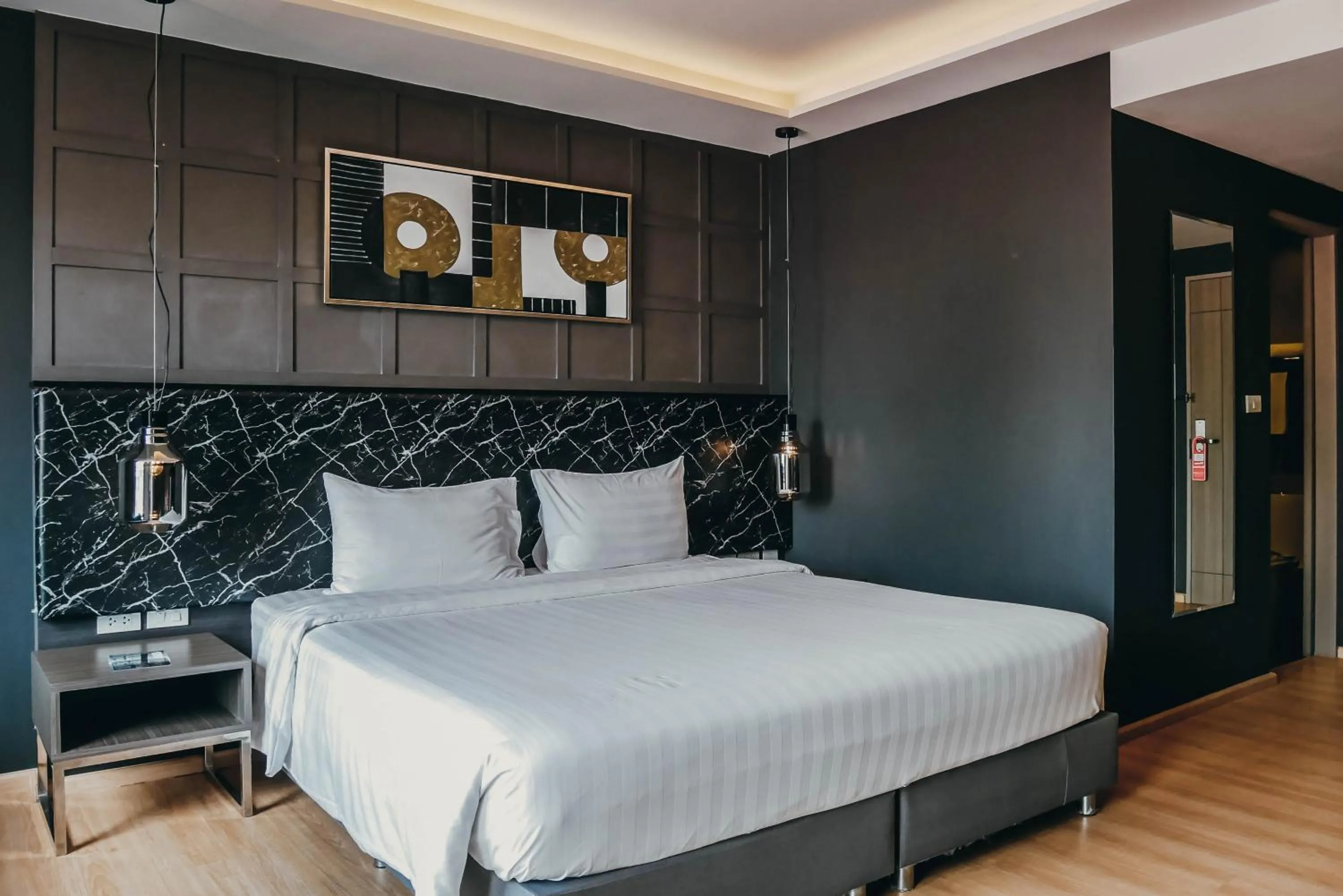 Bed in De Prime Rangnam Hotel