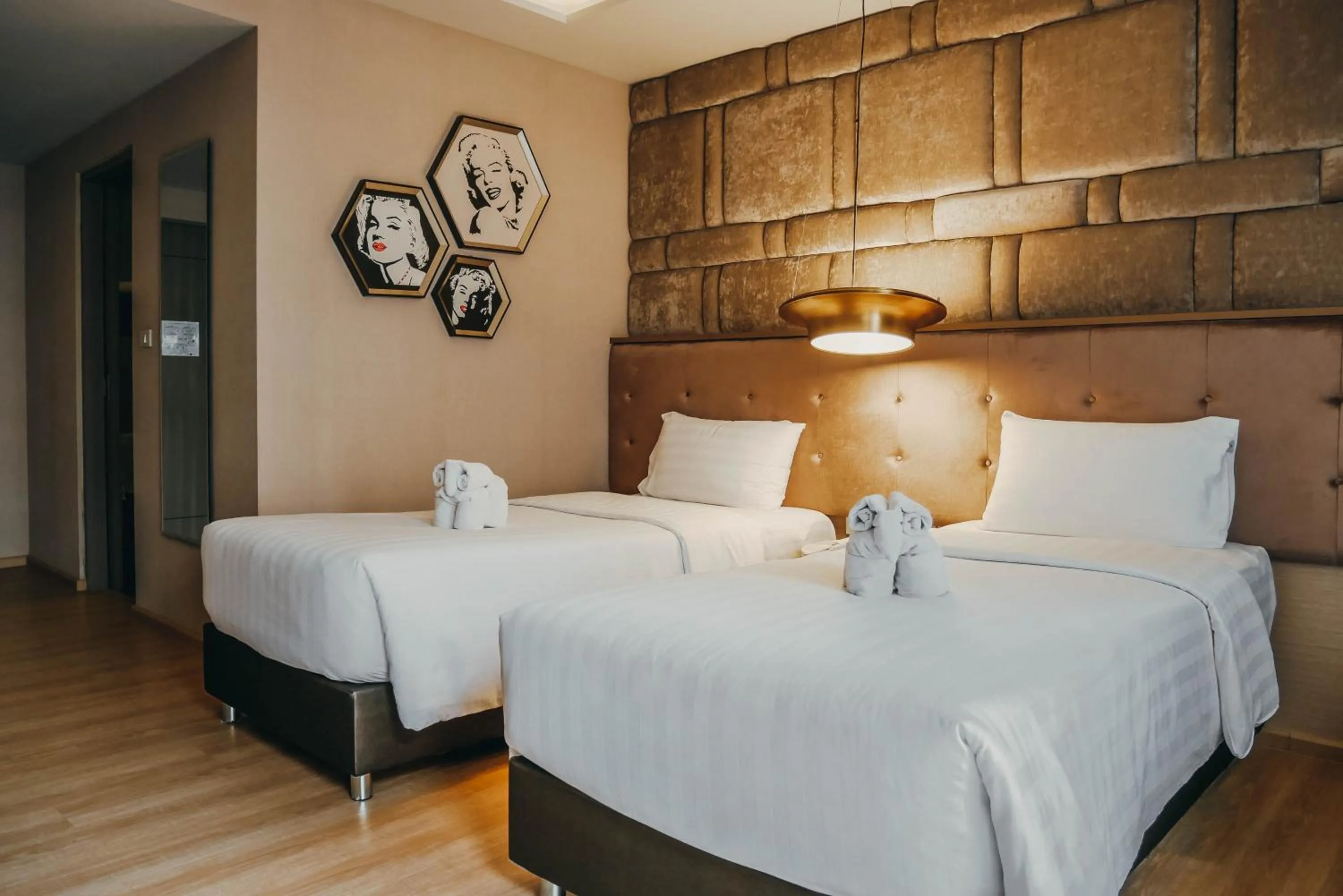 Bed in De Prime Rangnam Hotel