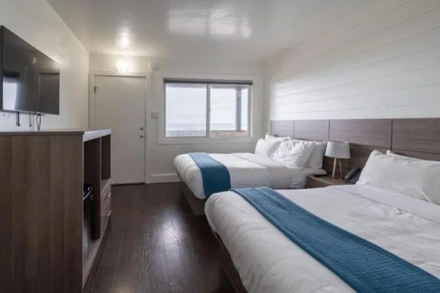 Bed in Sea Breeze Motel