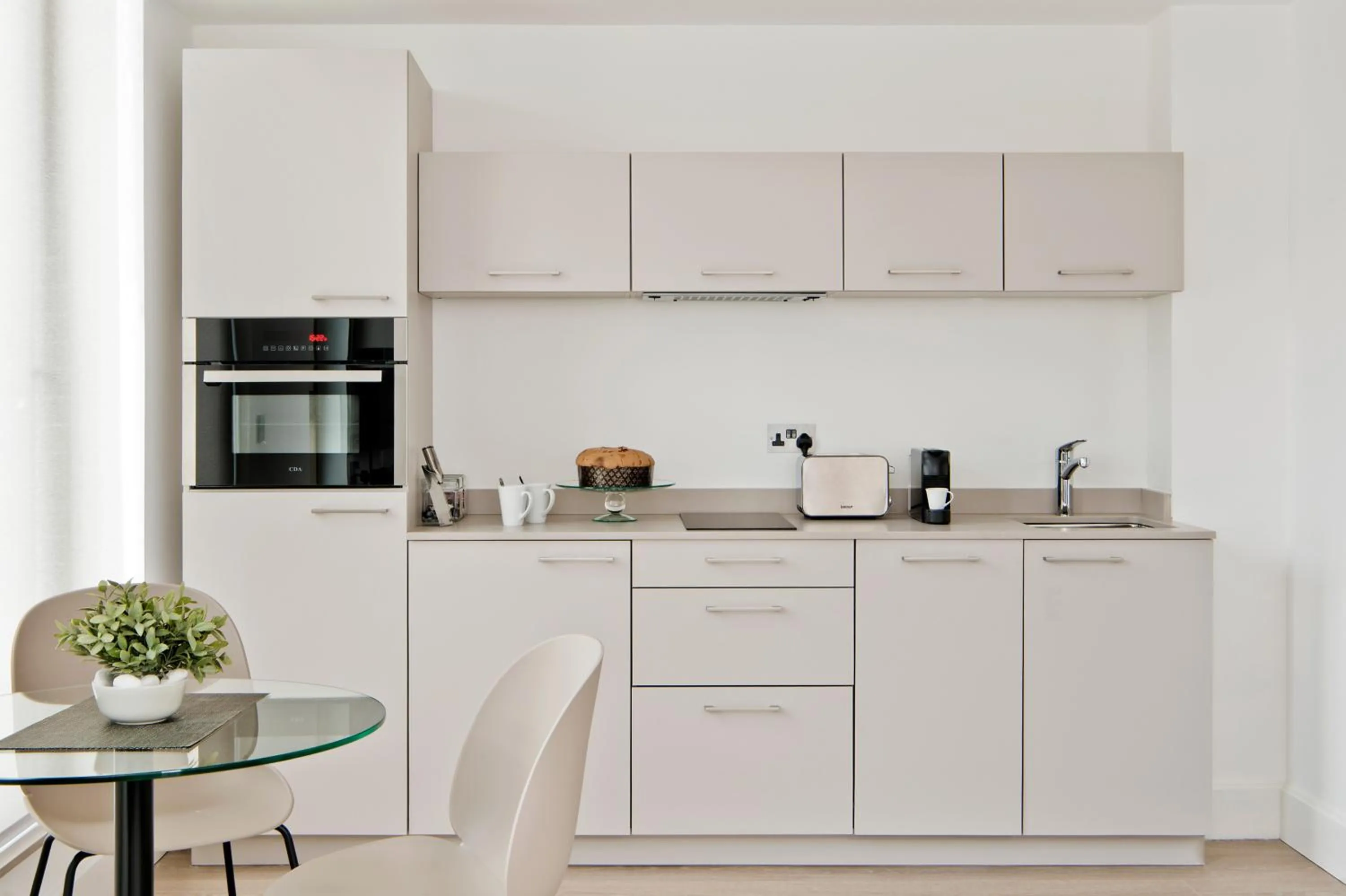 Kitchen or kitchenette in The Chronicle by Supercity Aparthotels