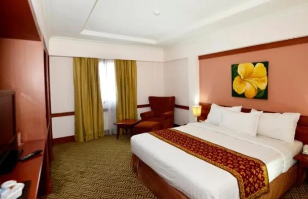 Bed in Abadi Suite Hotel & Tower