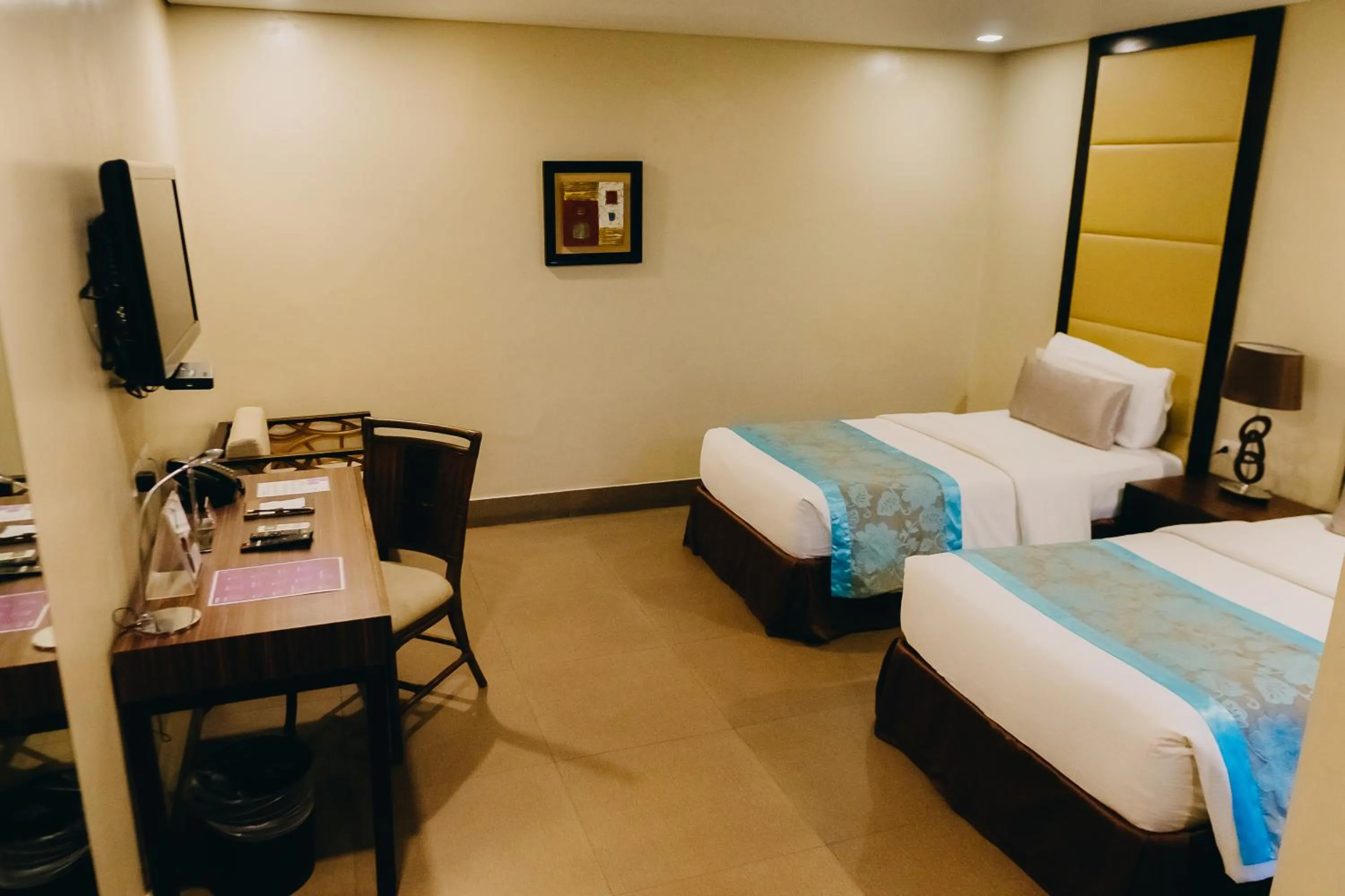 Bed in Goldberry Suites & Hotel Mactan