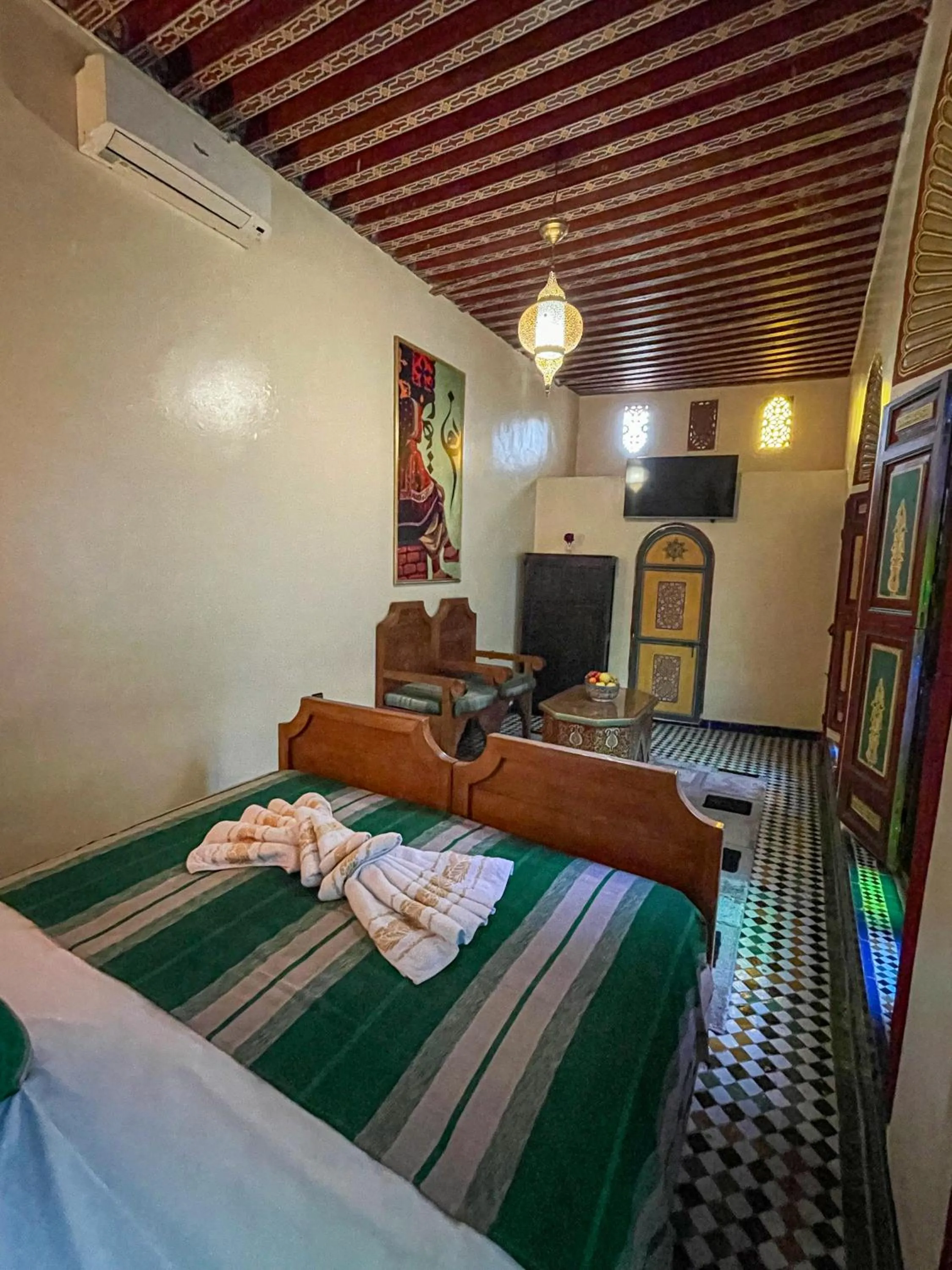 Communal lounge/ TV room, Bed in Riad Dar El Ouedghiri