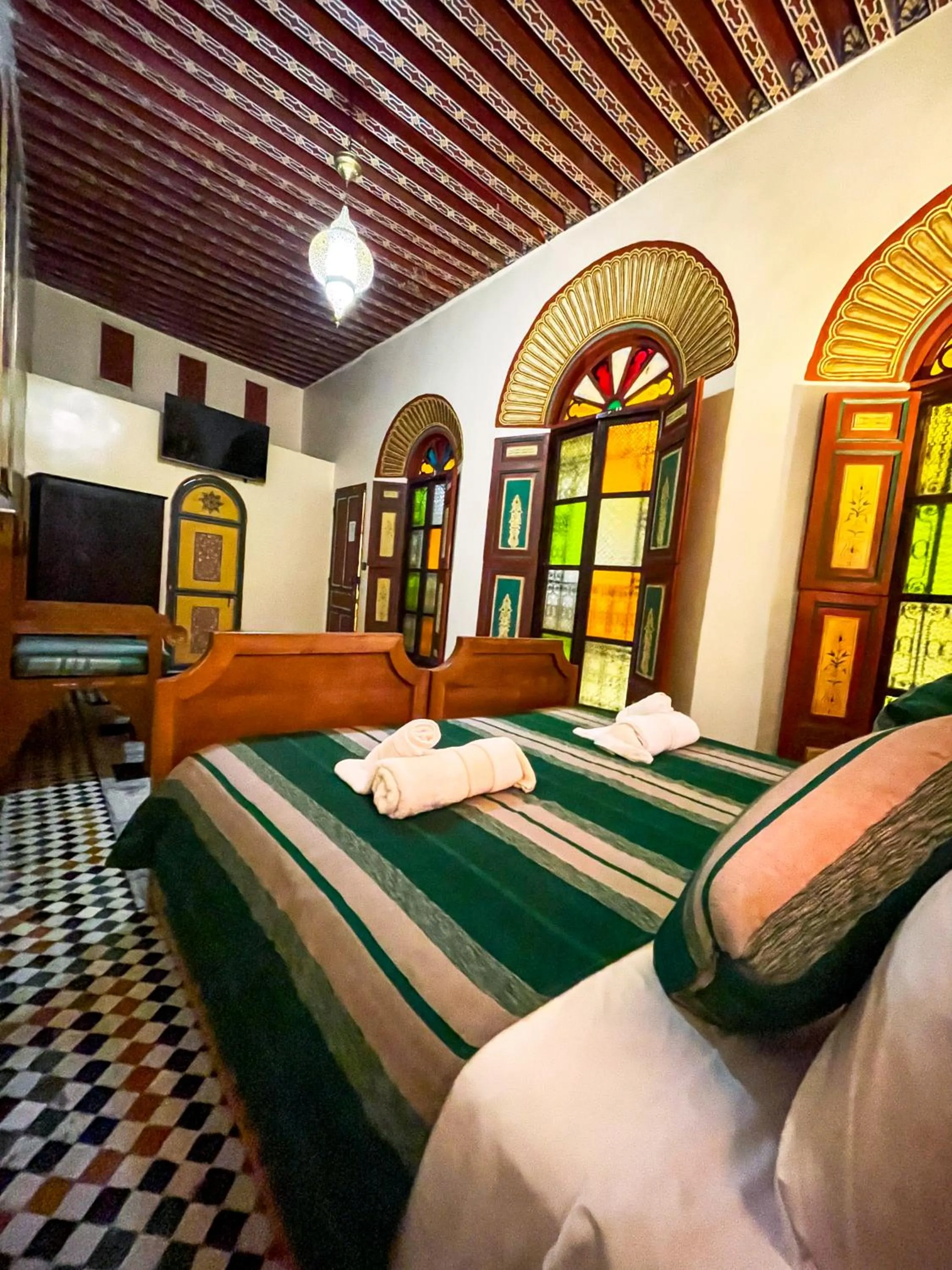 Bed in Riad Dar El Ouedghiri