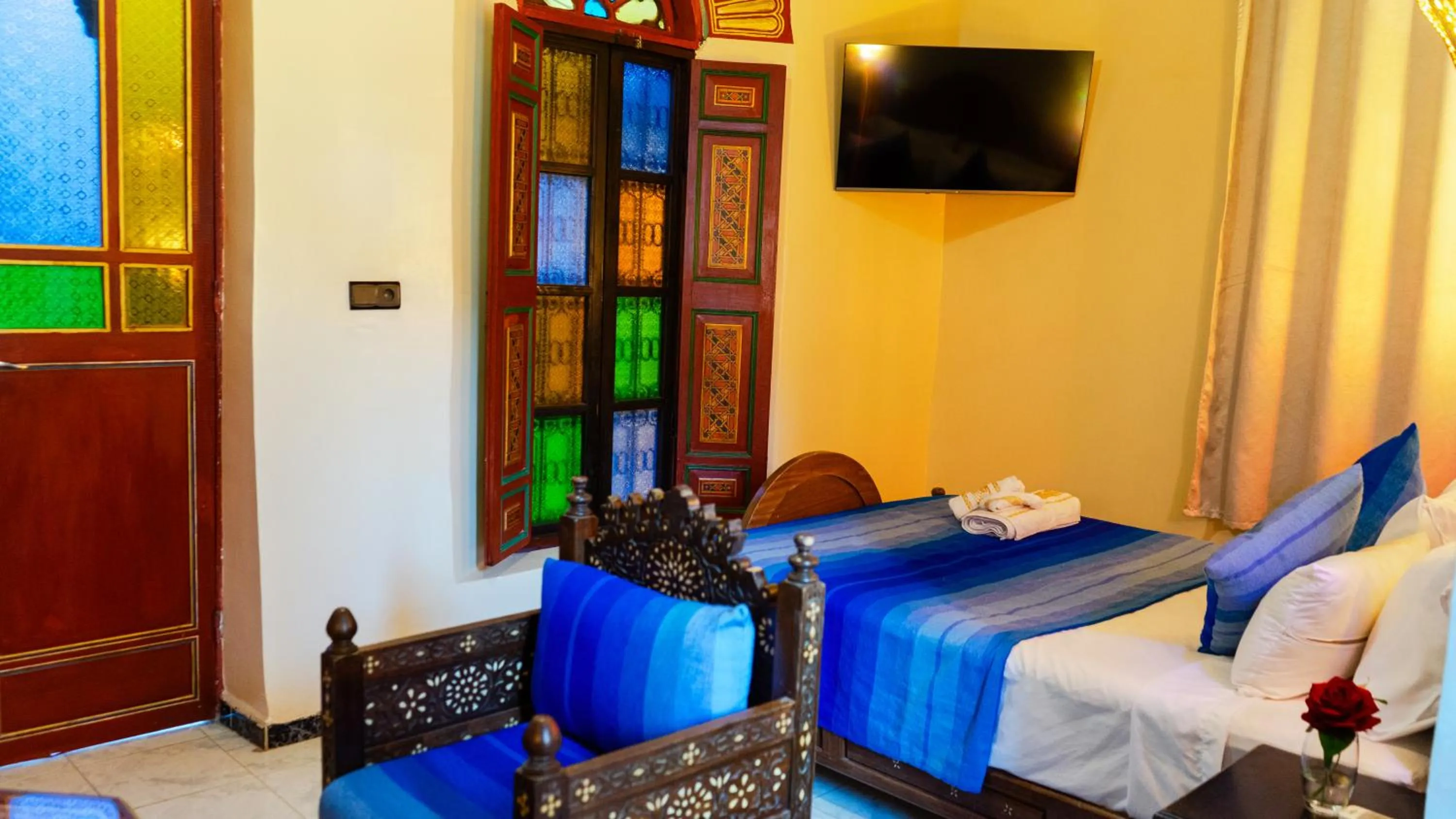 Communal lounge/ TV room, Bed in Riad Dar El Ouedghiri