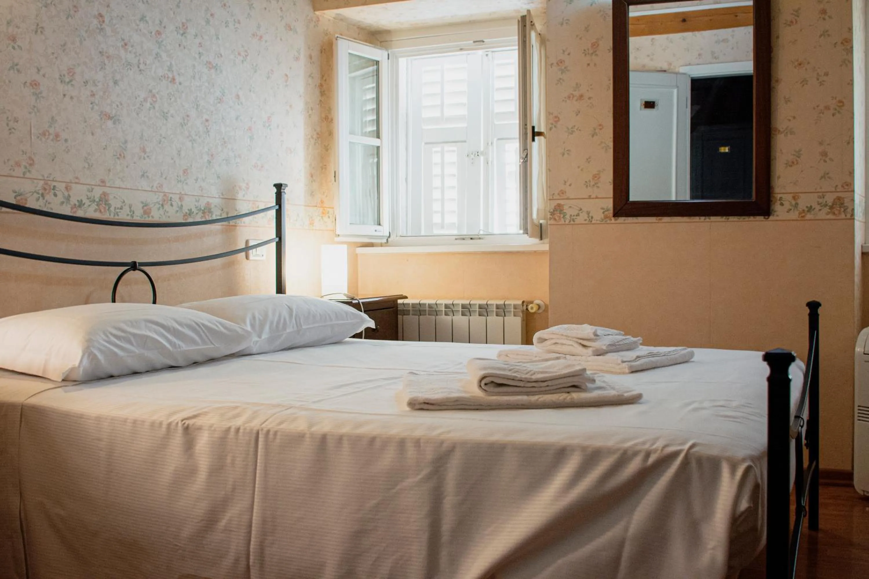 Bed in Hotel Capitelli