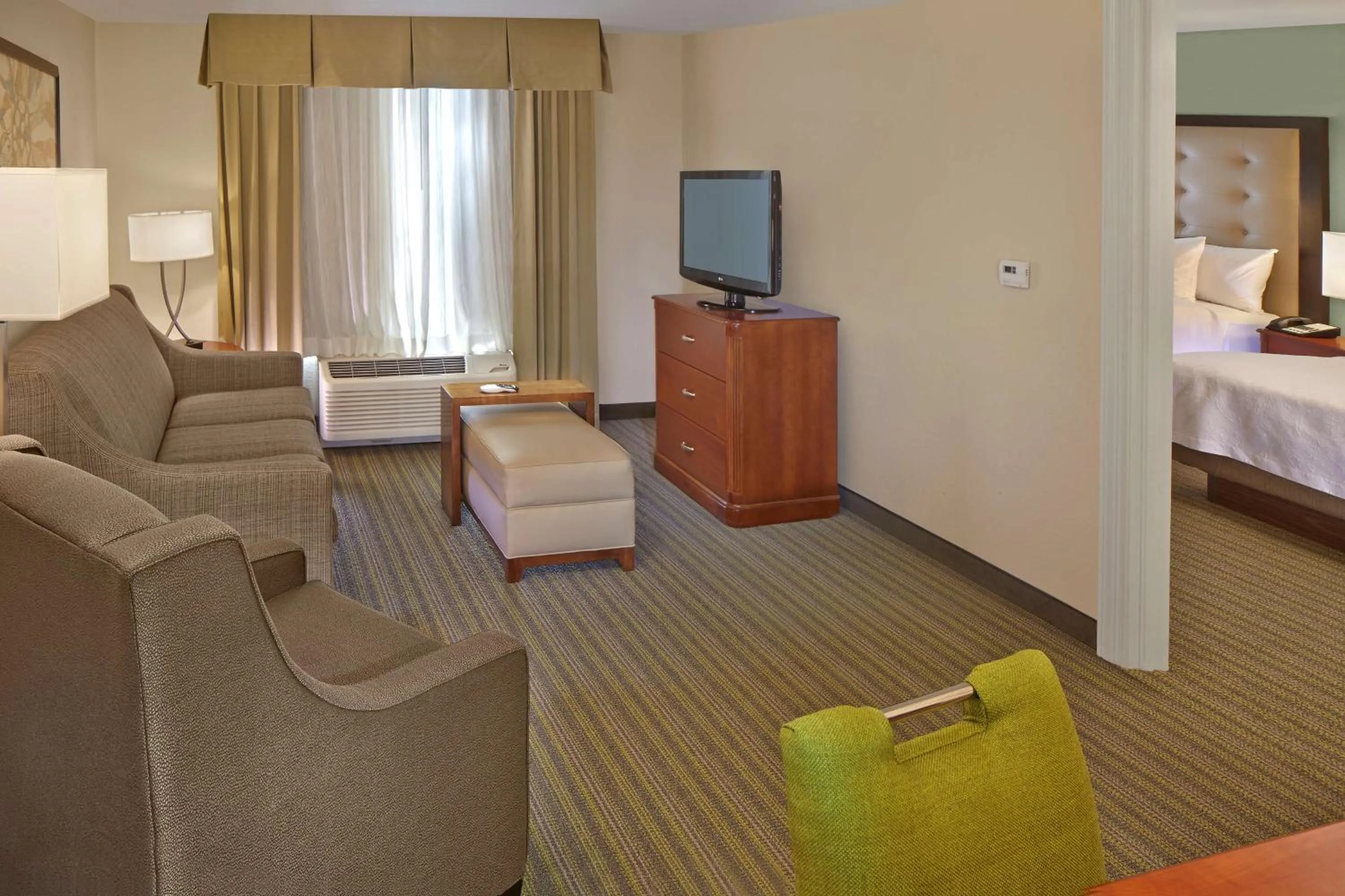 Living room, Bed in Homewood Suites by Hilton Daytona Beach Speedway-Airport