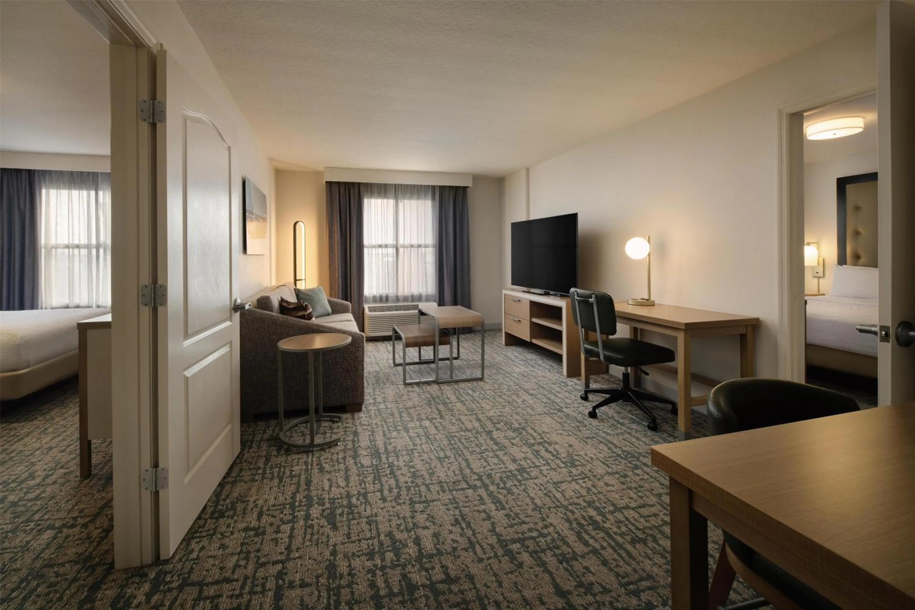 Living room, Bed in Homewood Suites by Hilton Daytona Beach Speedway-Airport