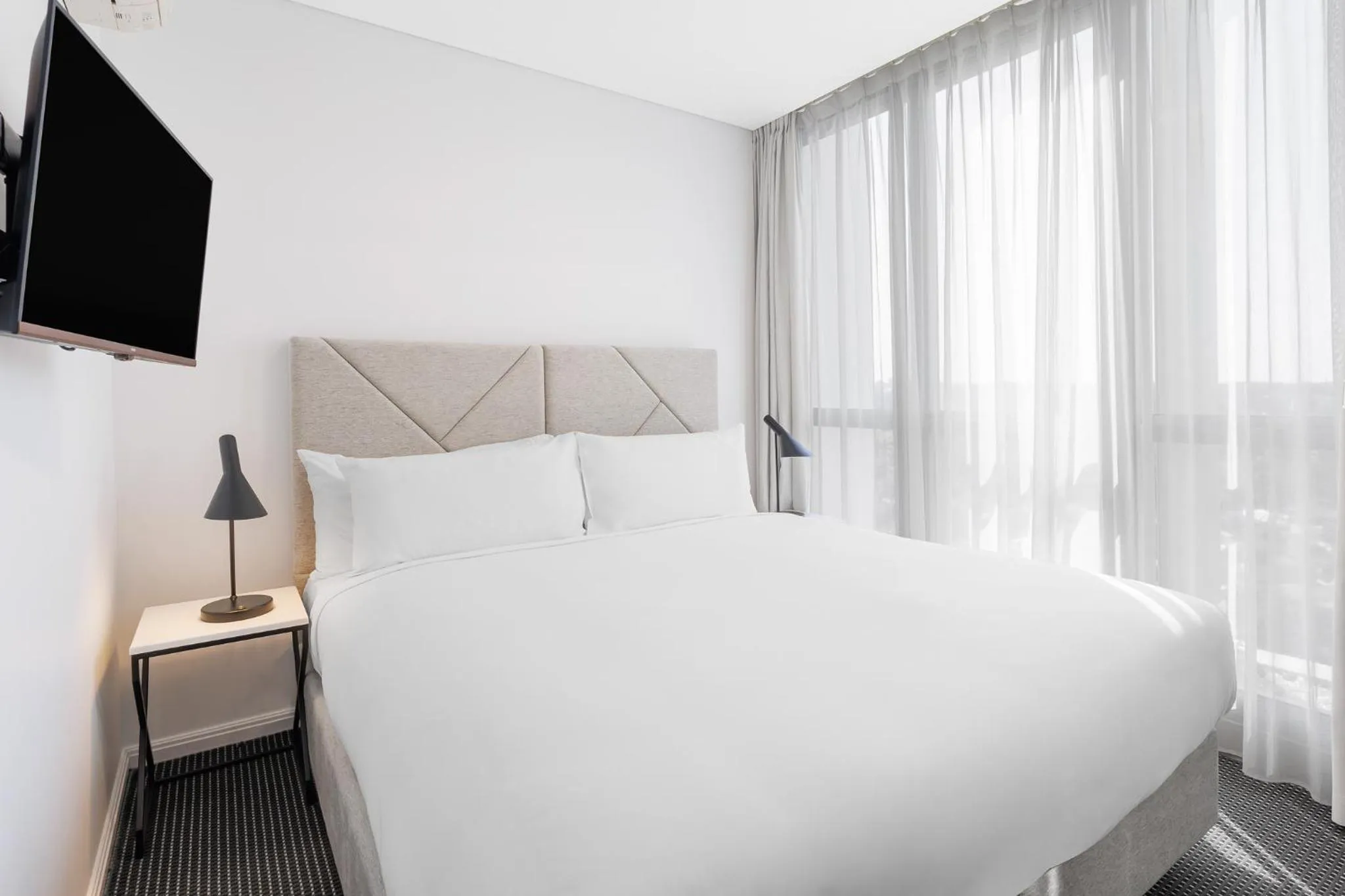 Bed in Meriton Suites Zetland