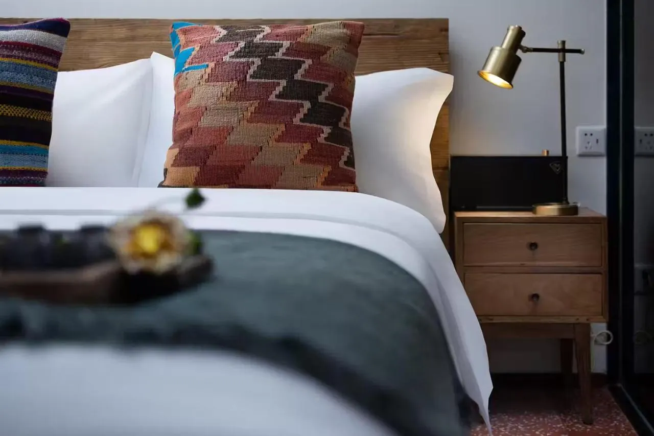 Bed in Peking Yard Boutique Hotel