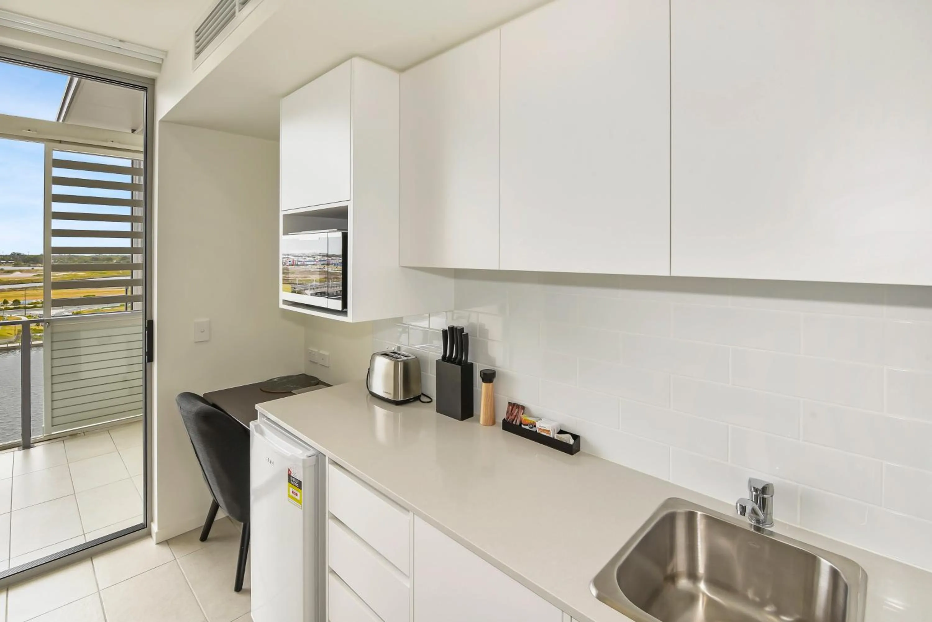 Kitchen or kitchenette in North Shore Oceanside Kawana