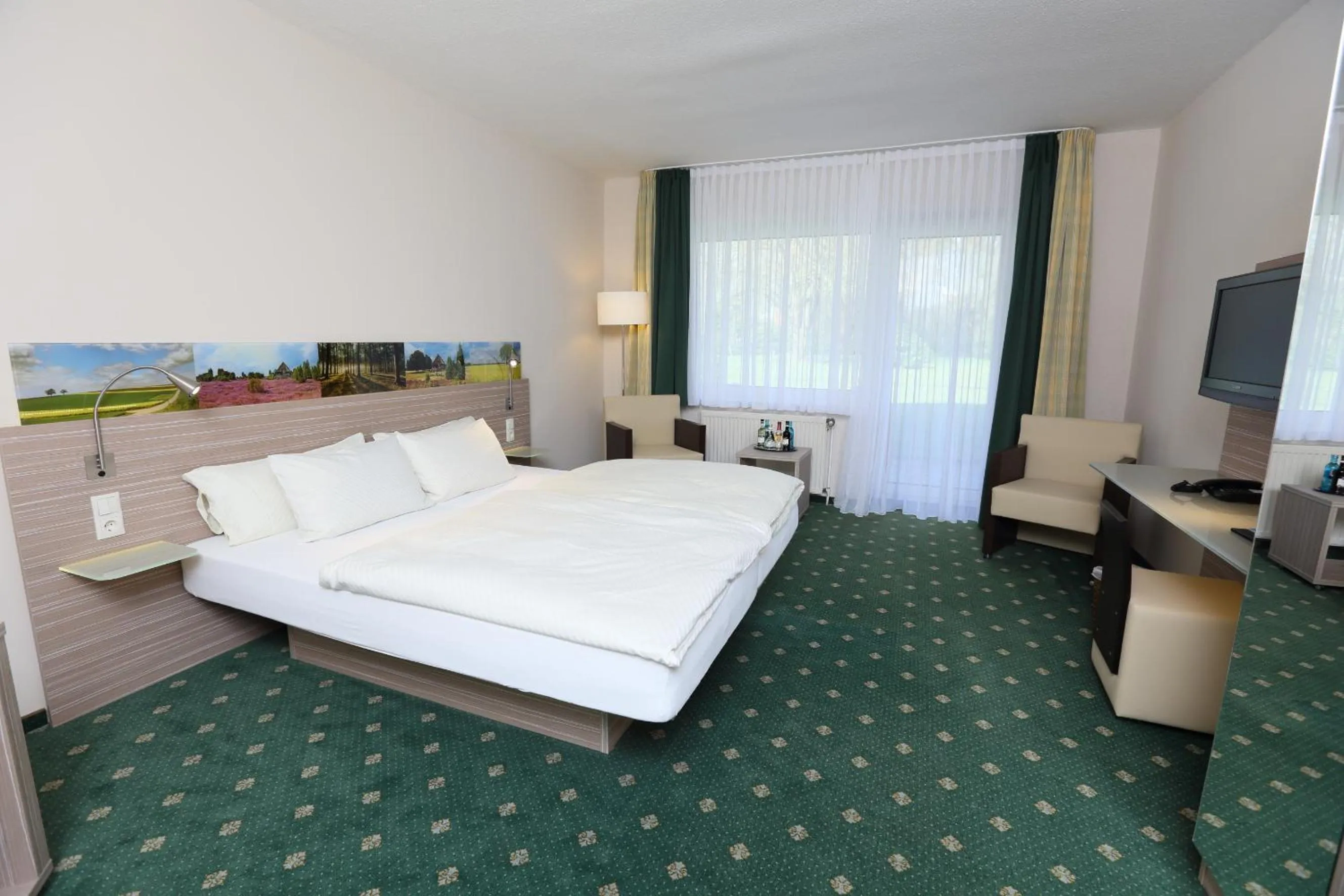 Photo of the whole room, Bed in Jeddinger Hof Land- und Seminarhotel
