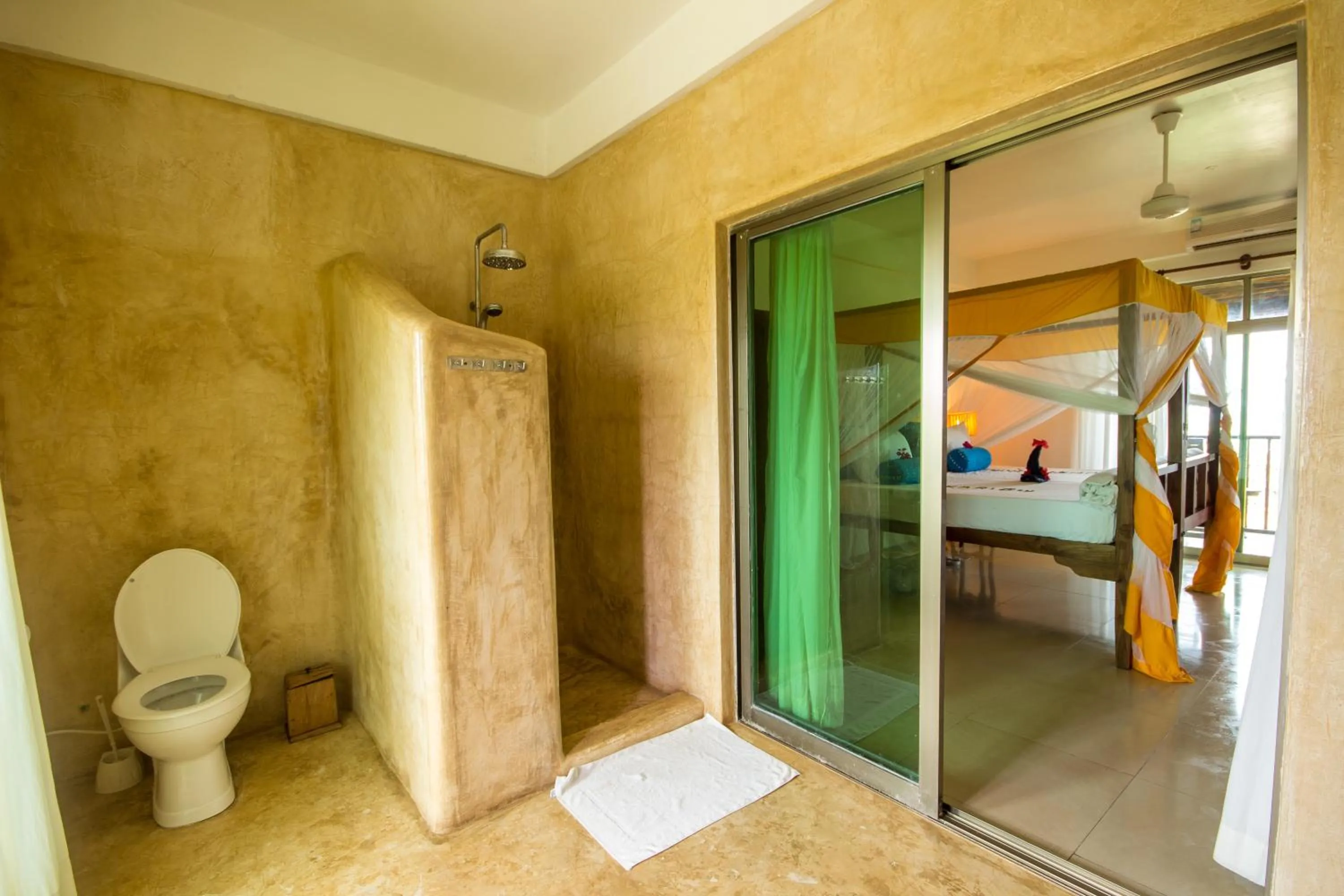 Bathroom, Bed in The Zanzibari