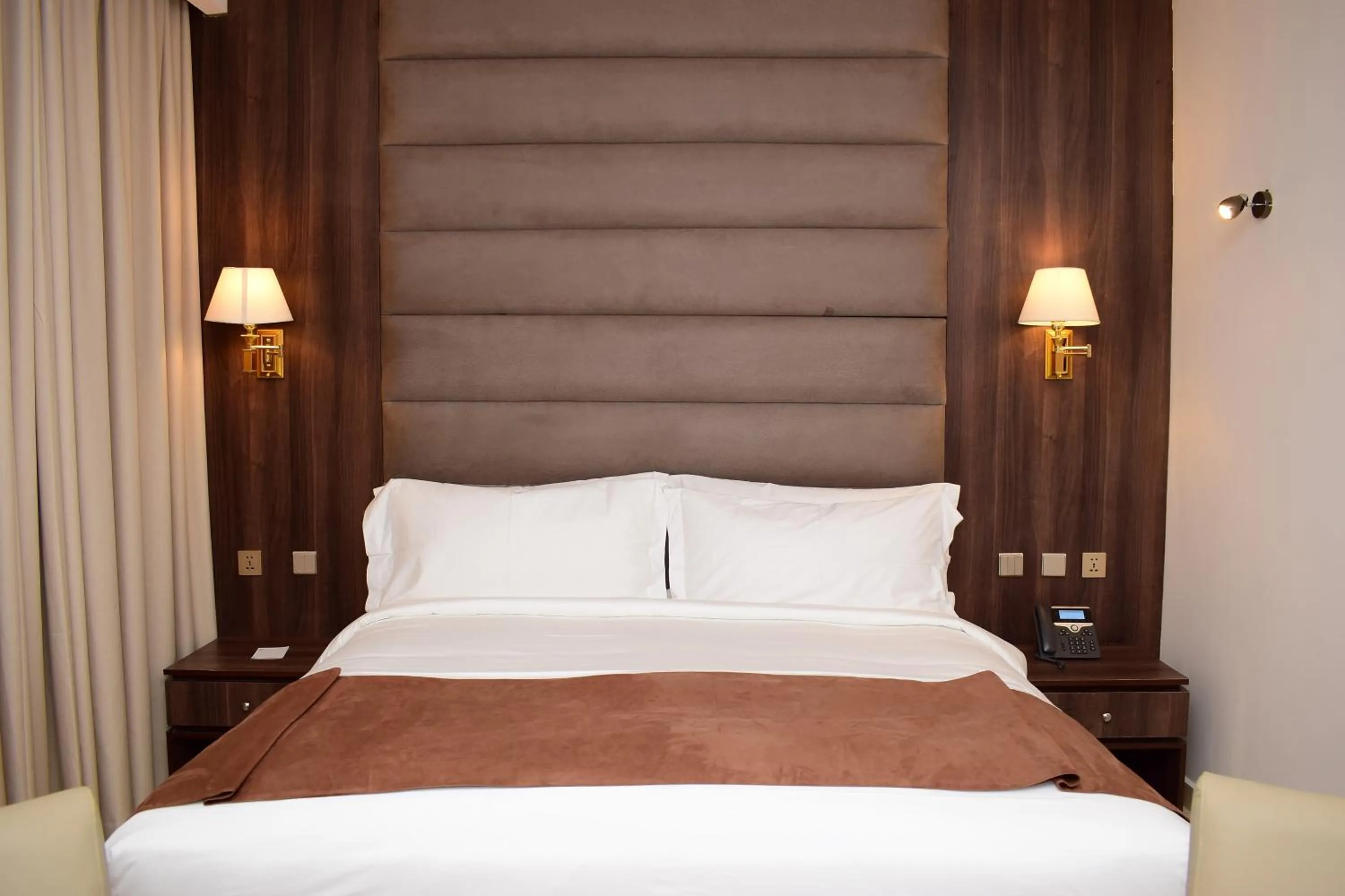 Bed in Monty Suites & Golf