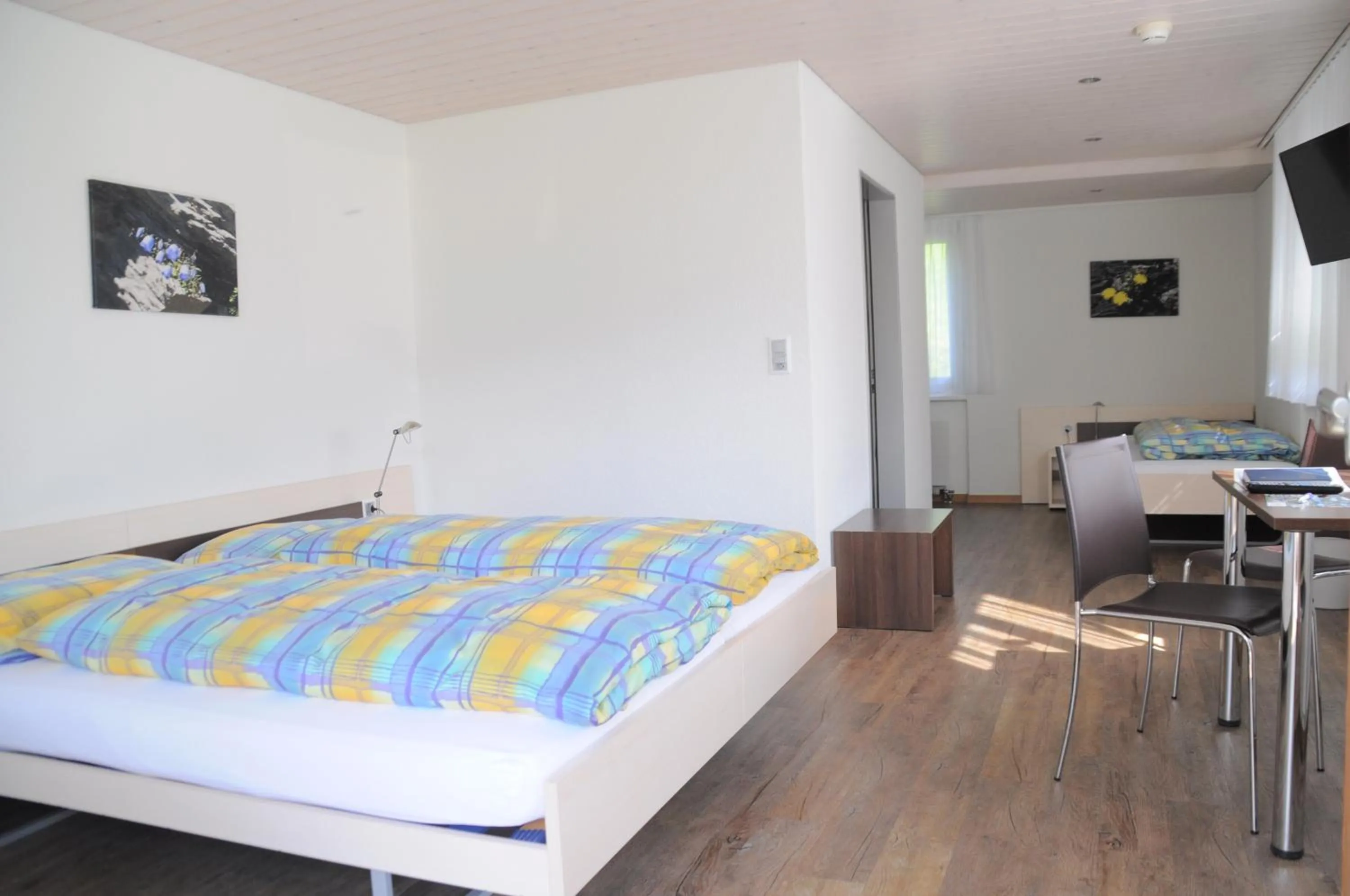 Photo of the whole room, Bed in Ferien- und Familienhotel Alpina Adelboden