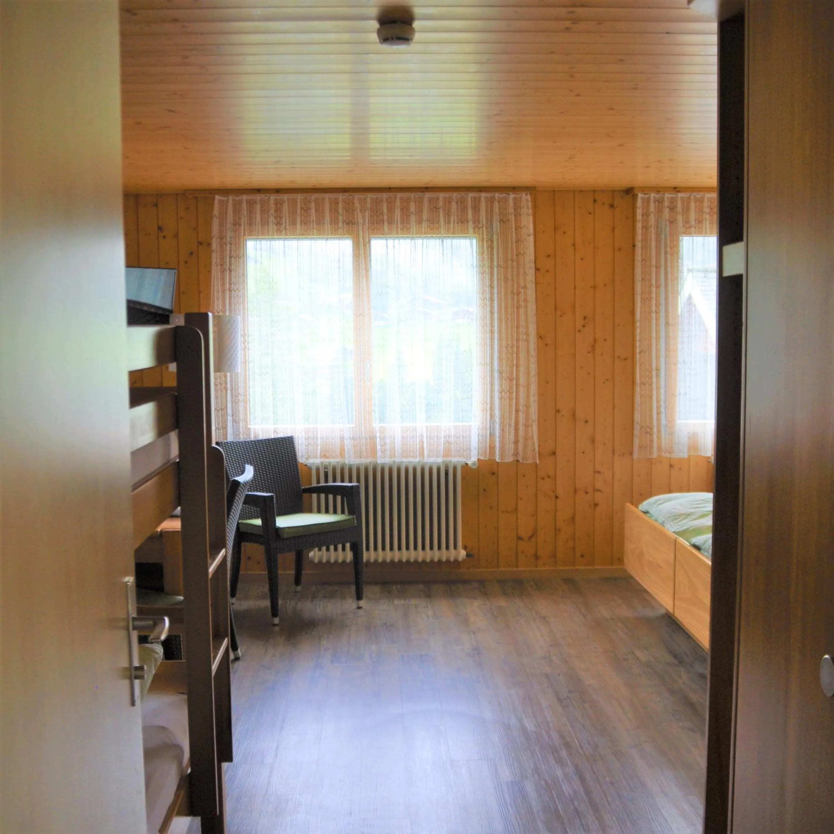 Photo of the whole room, Bed in Ferien- und Familienhotel Alpina Adelboden