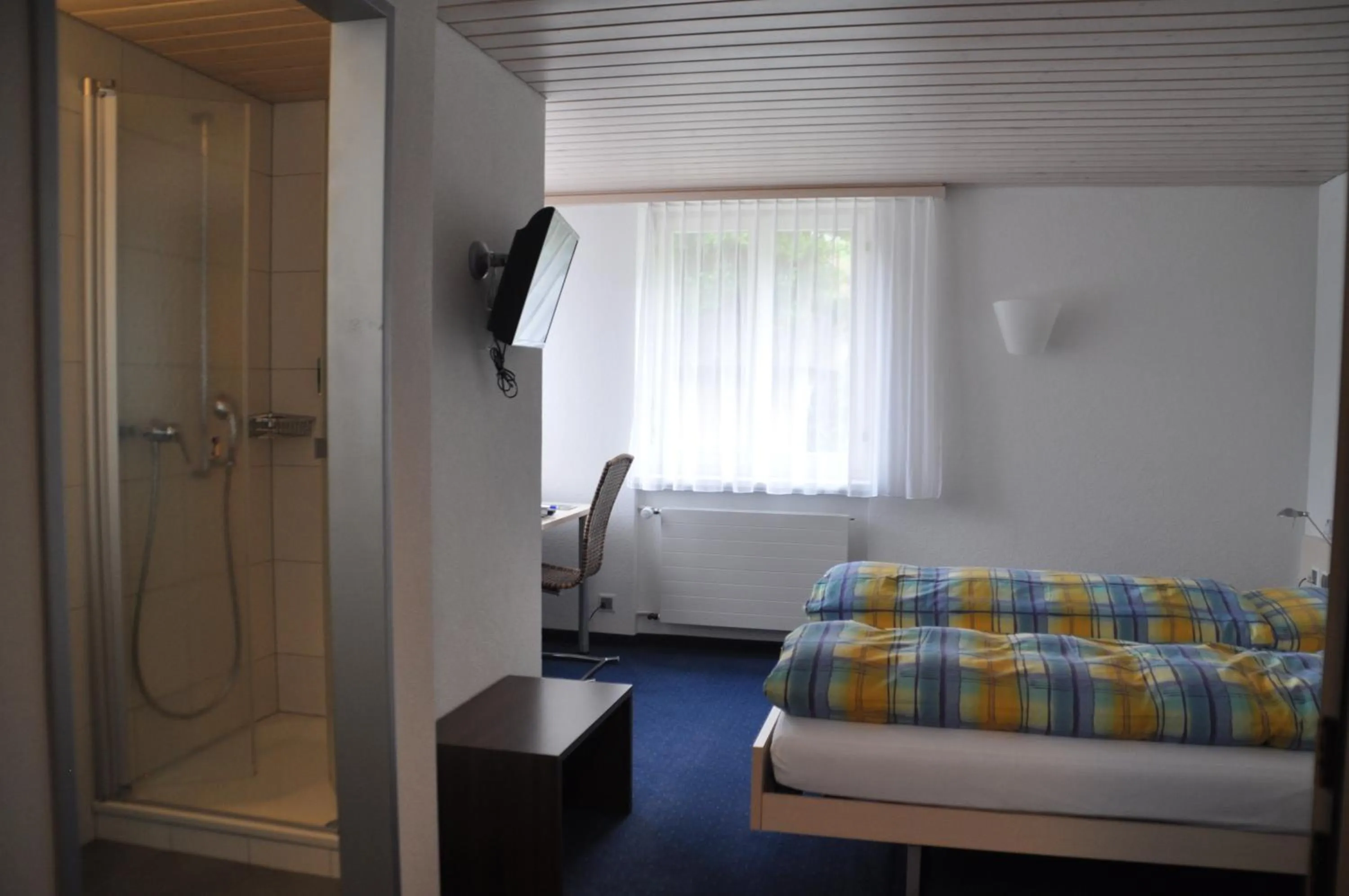 Photo of the whole room, Bed in Ferien- und Familienhotel Alpina Adelboden