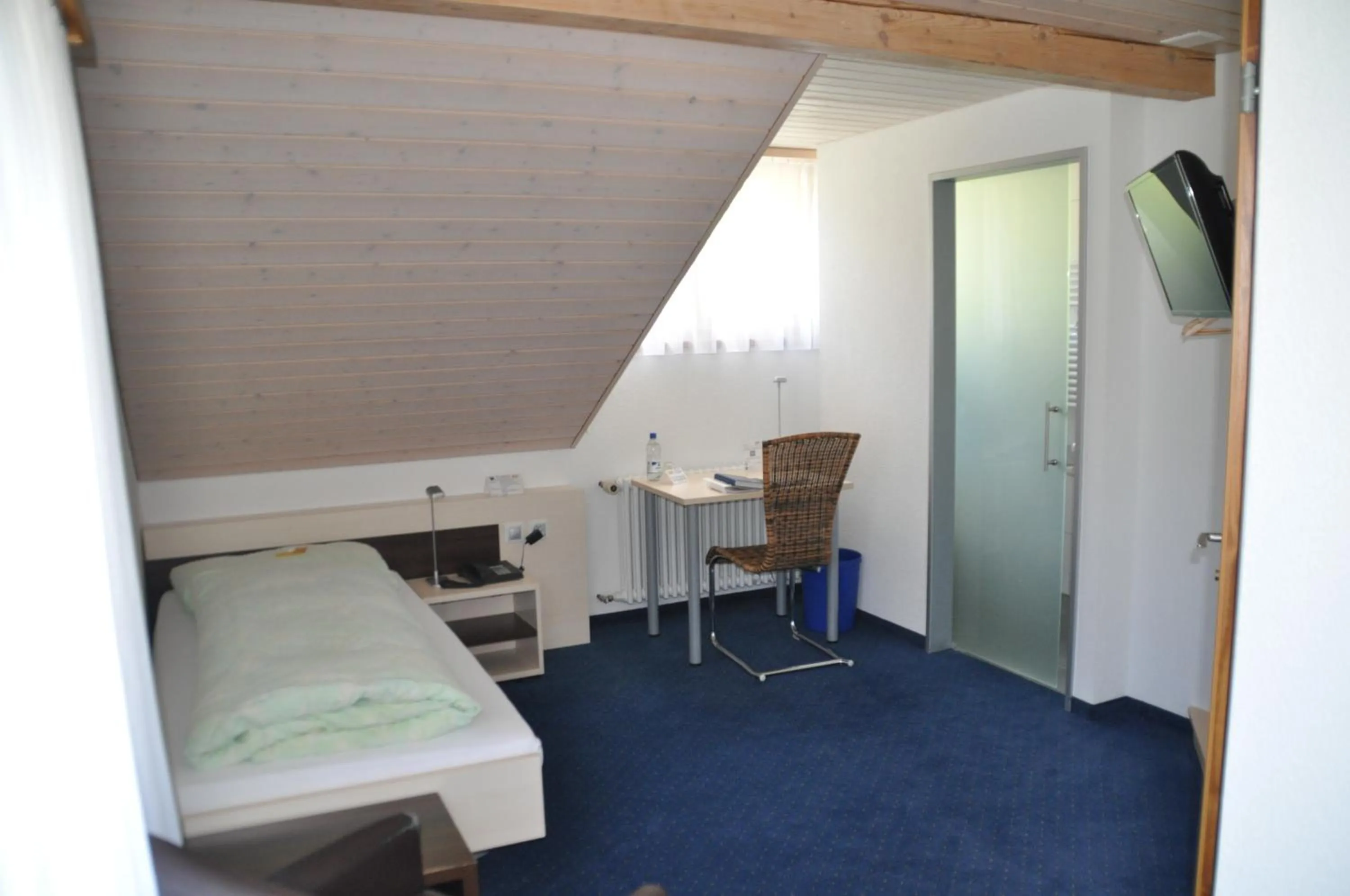 Photo of the whole room, Bed in Ferien- und Familienhotel Alpina Adelboden