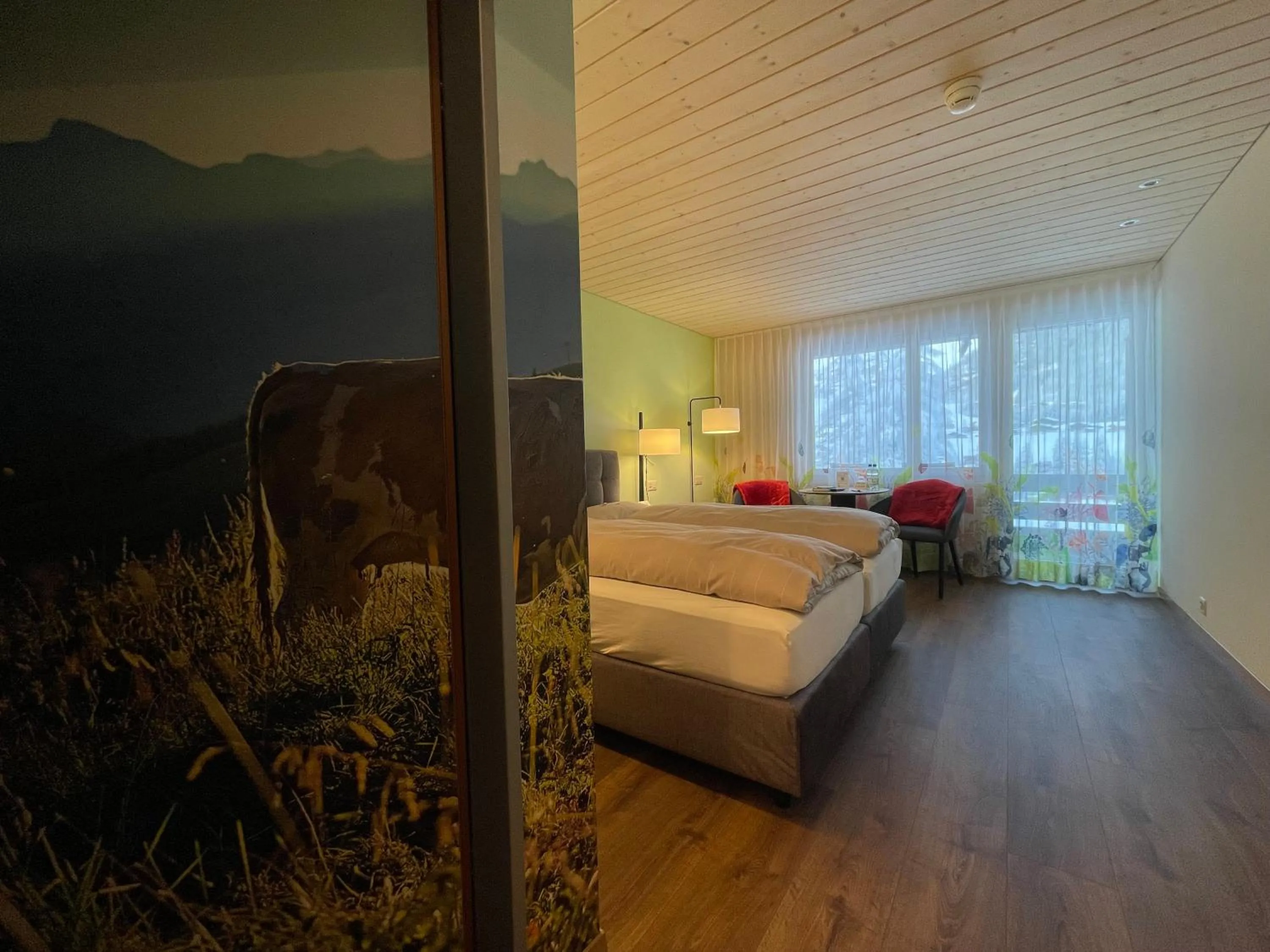 Photo of the whole room, Bed in Ferien- und Familienhotel Alpina Adelboden