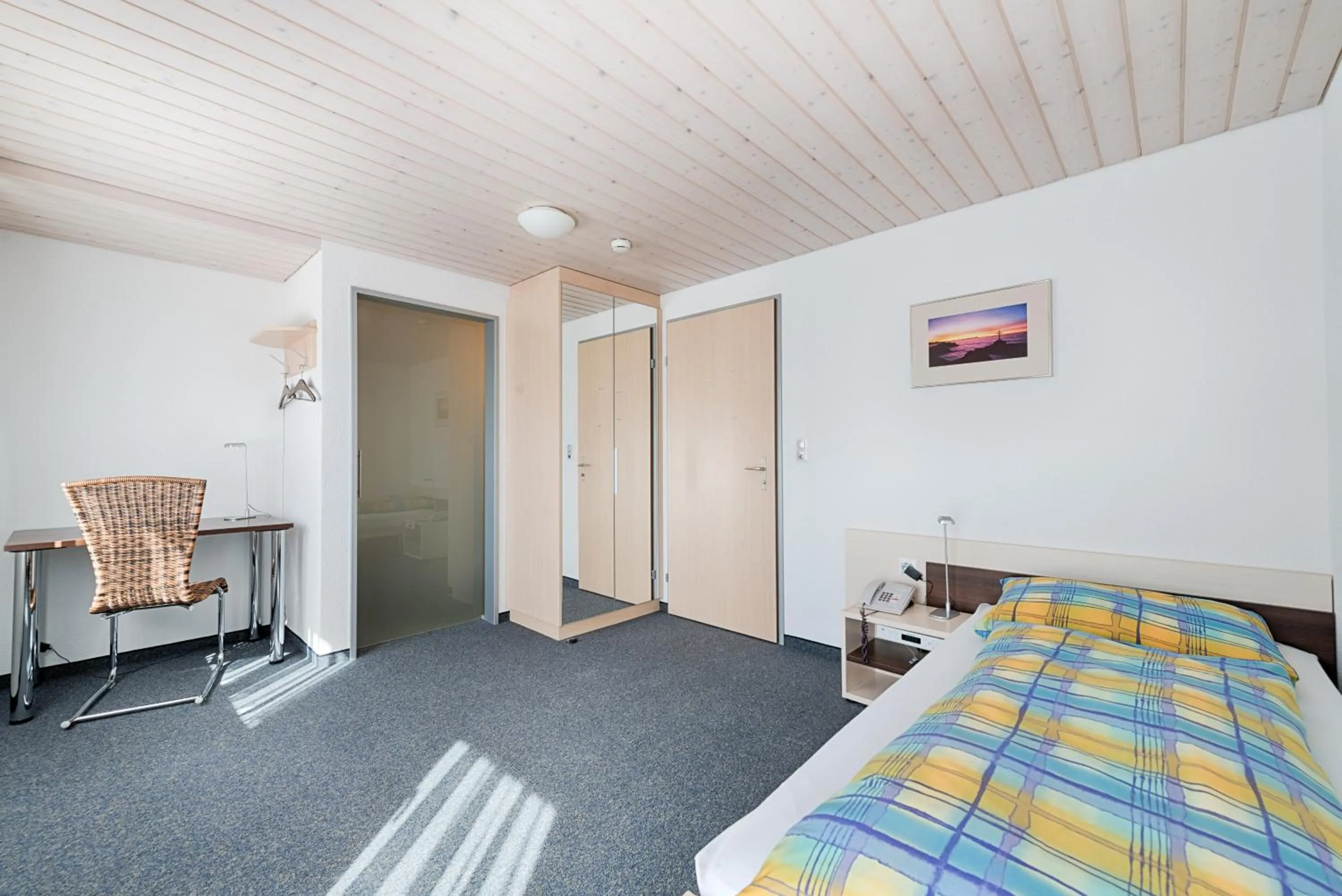 Photo of the whole room, Bed in Ferien- und Familienhotel Alpina Adelboden