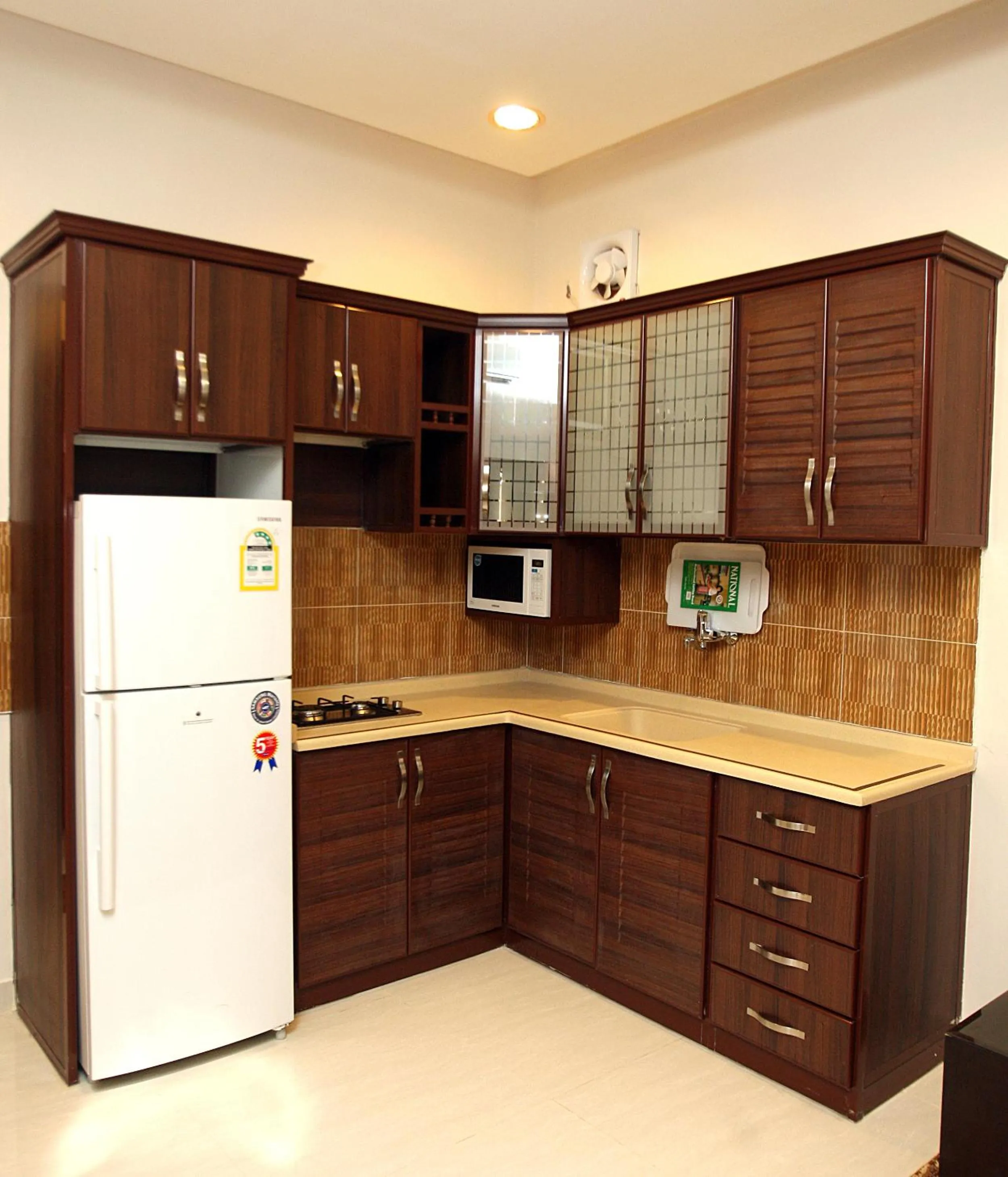 Kitchen or kitchenette in Rest Night Serviced Apartments - Al Nafal