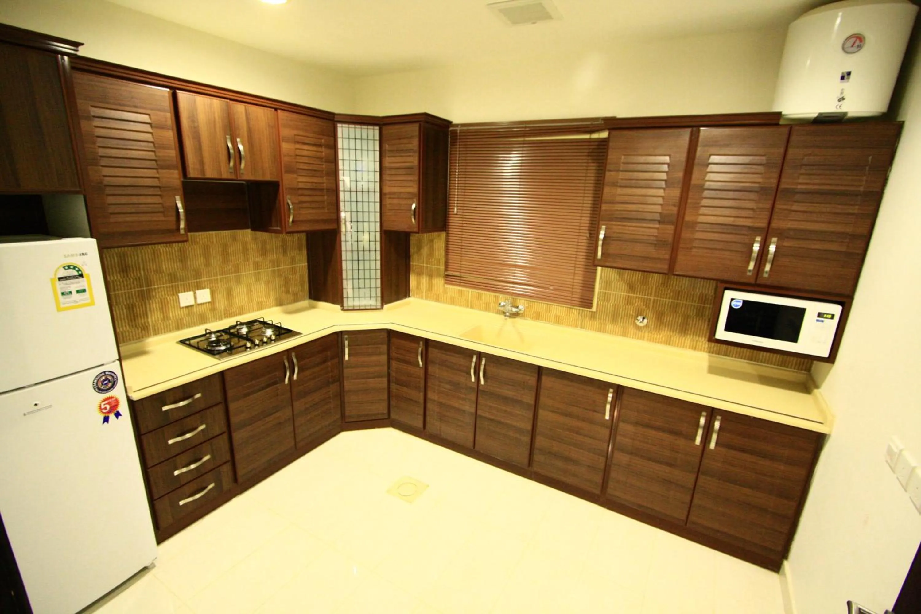 Kitchen or kitchenette in Rest Night Serviced Apartments - Al Nafal