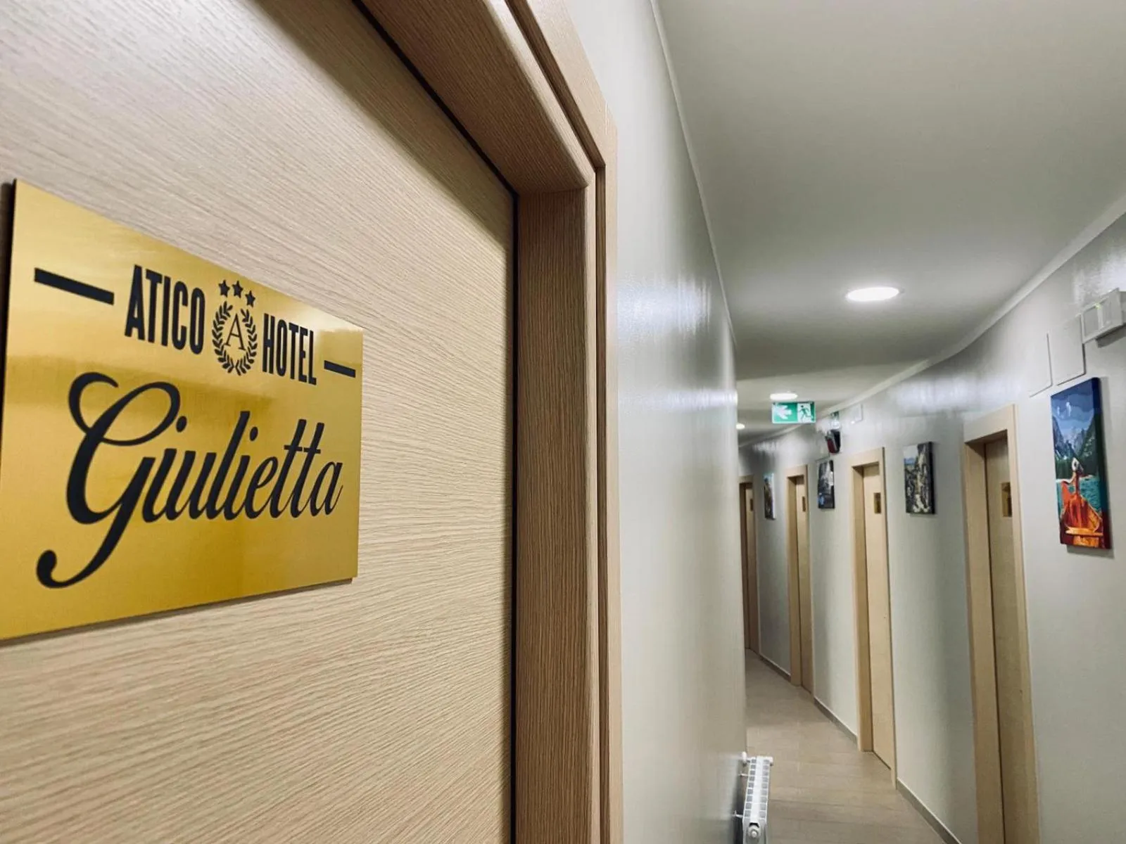 Property logo or sign in Atico Hotel