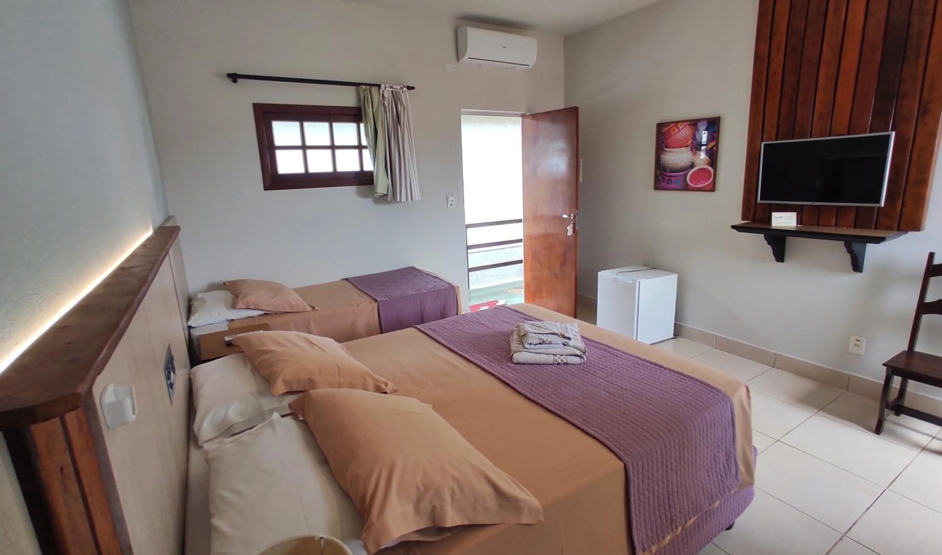 Bed in Pousada Novo Prado