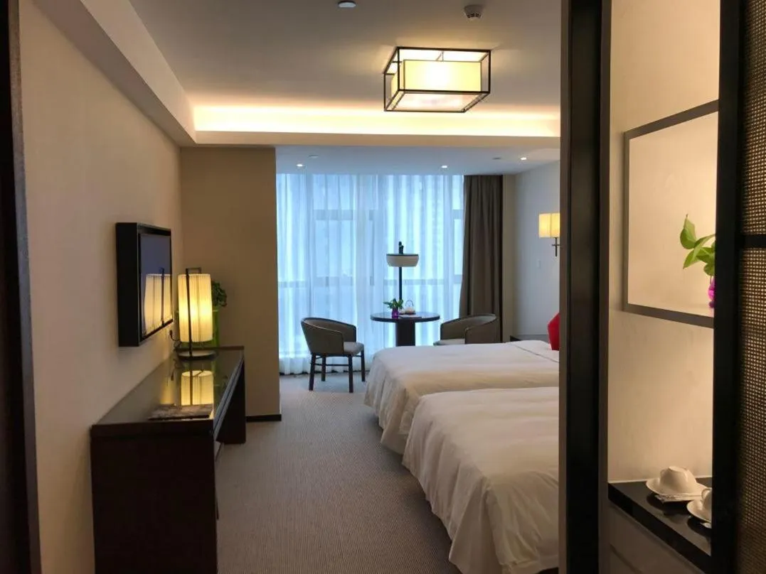 Photo of the whole room, Bed in SSAW Boutique Hotel Ningbo CBD - Family Friendly & Business Travel