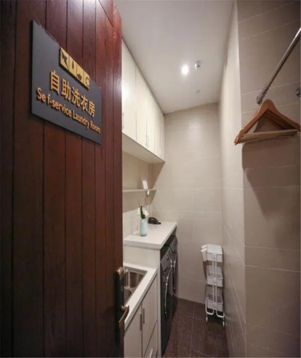 washing machine in SSAW Boutique Hotel Ningbo CBD - Family Friendly & Business Travel