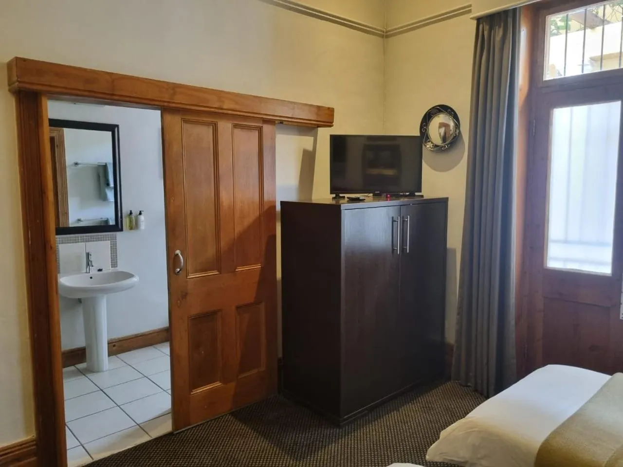 Bed in Ashanti Gardens Guesthouse