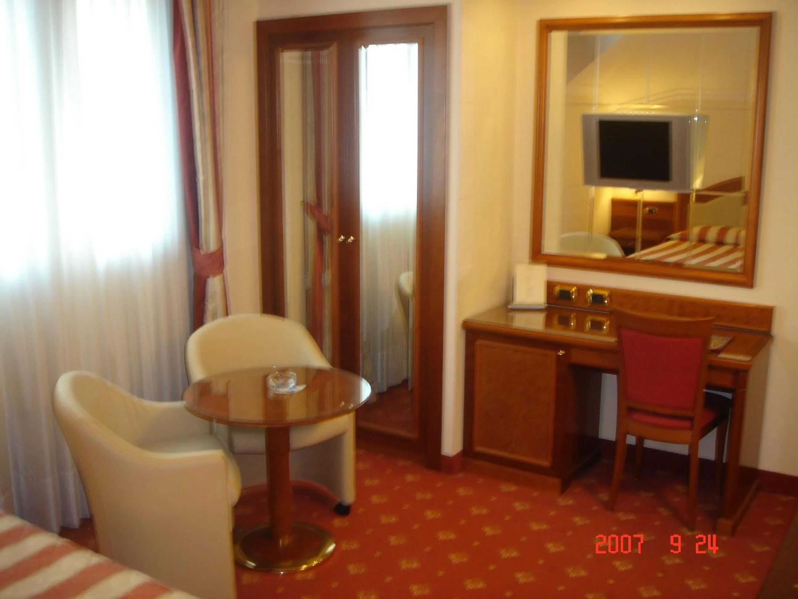 Seating area, Bed in Albergo Corona