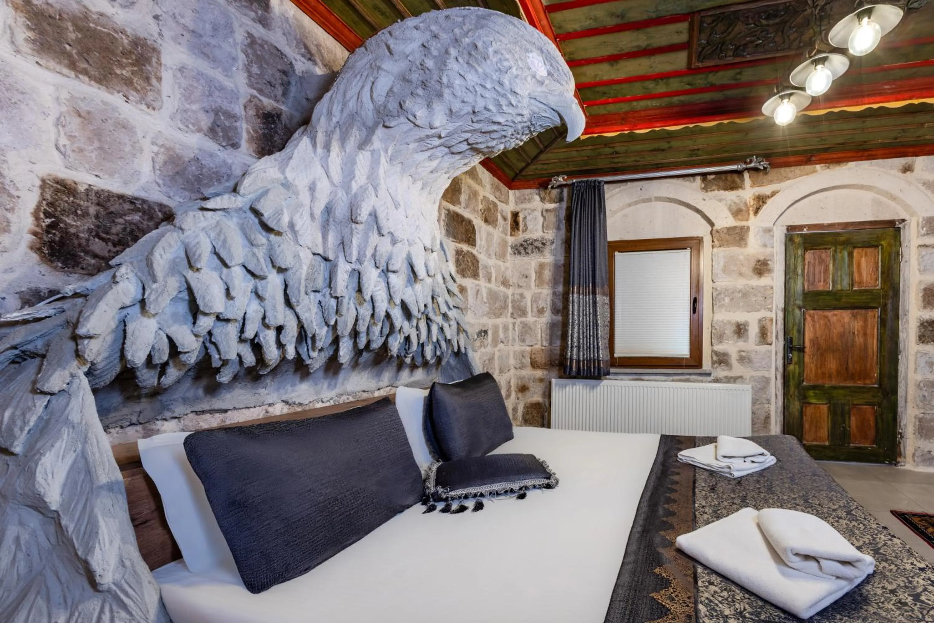 Bed in Kayatas Cave Suites