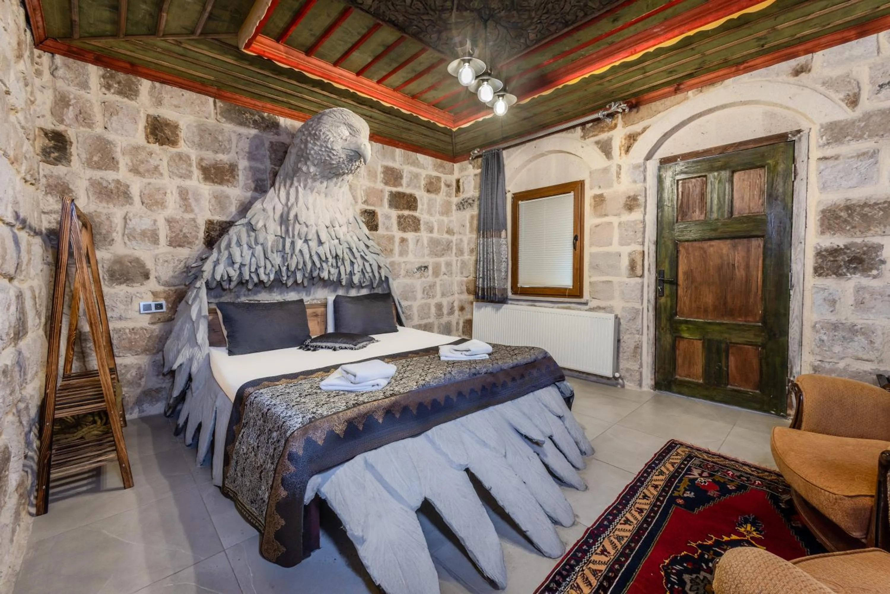 Bed in Kayatas Cave Suites