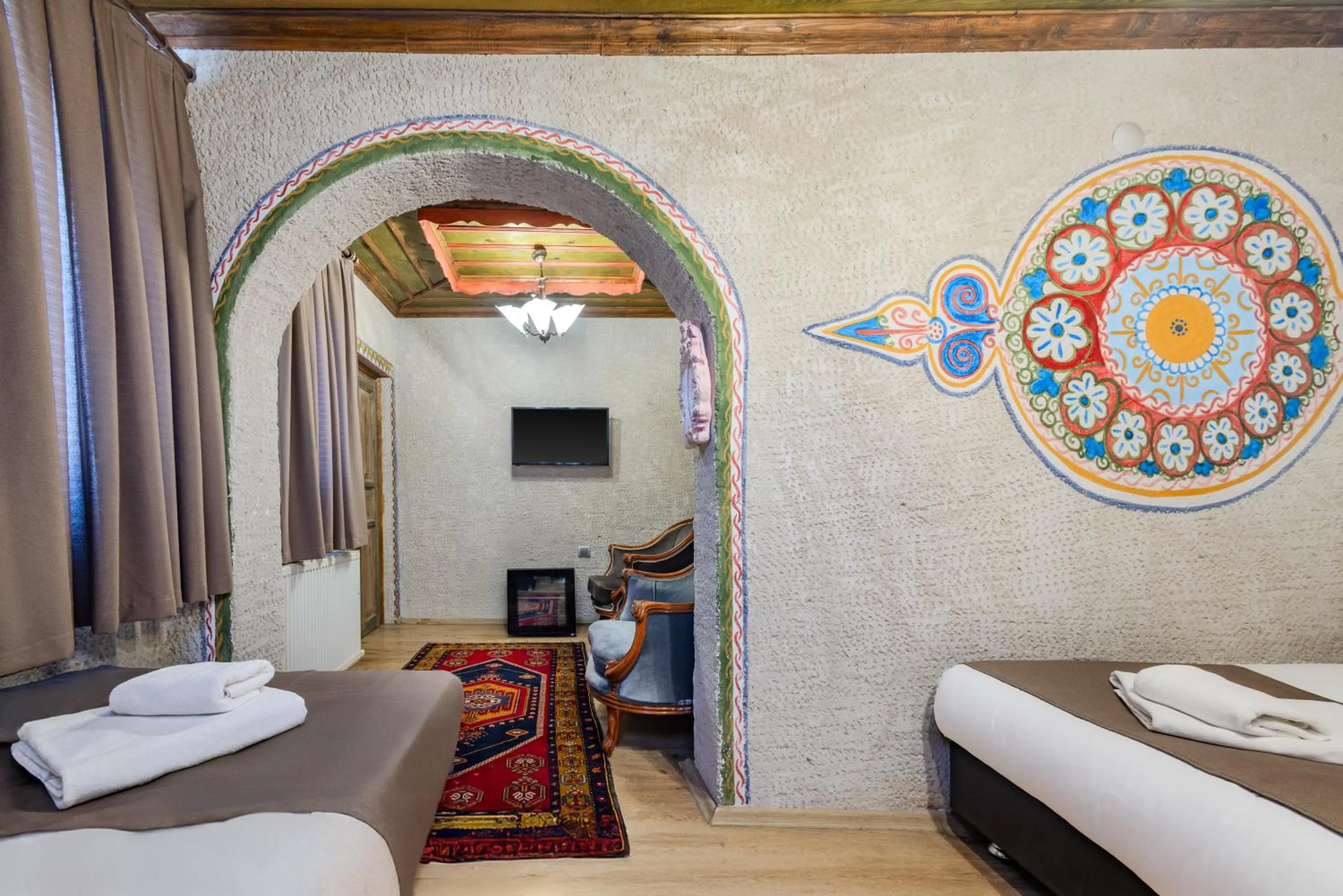 Bed in Kayatas Cave Suites