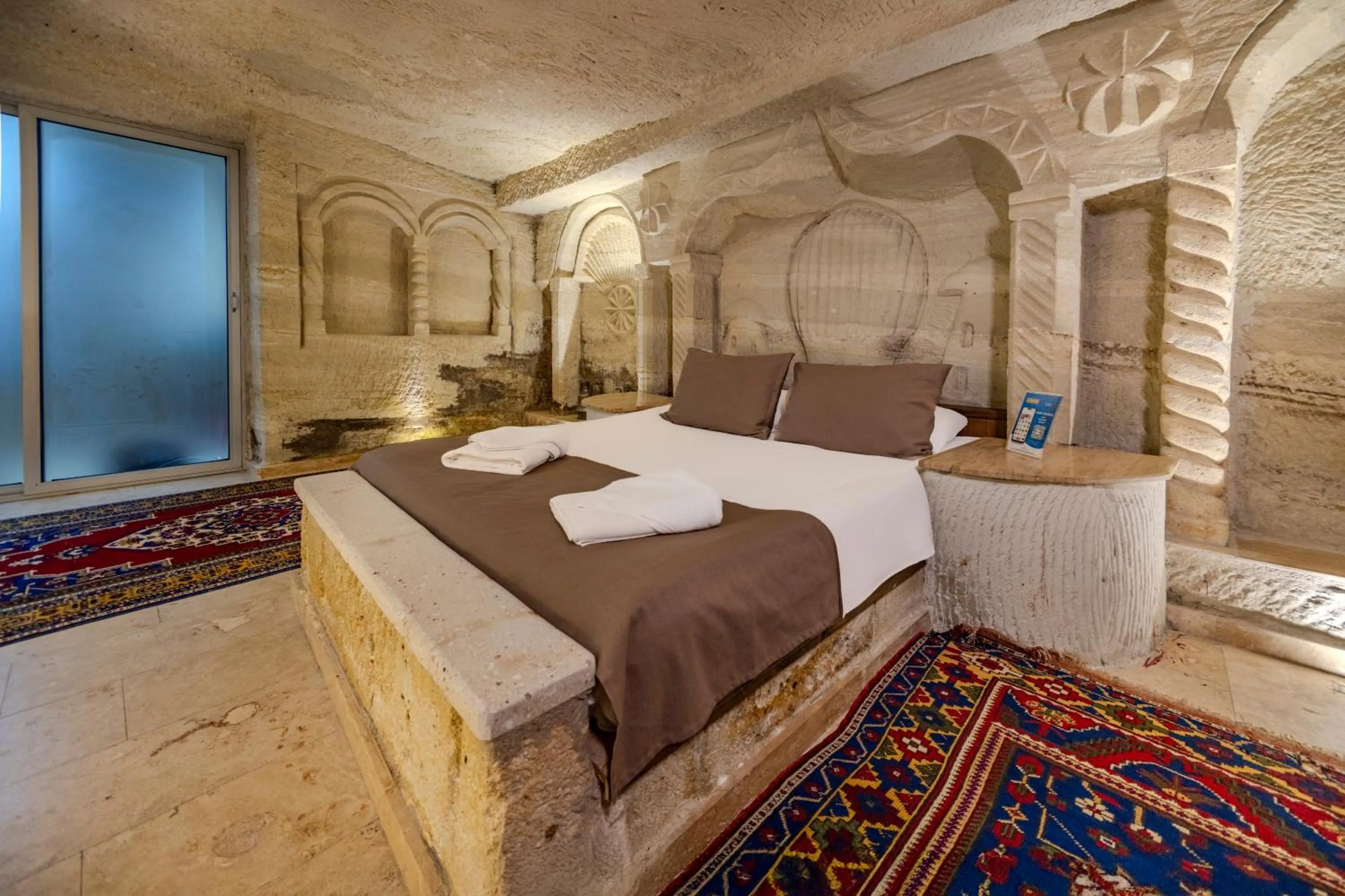 Bed in Kayatas Cave Suites