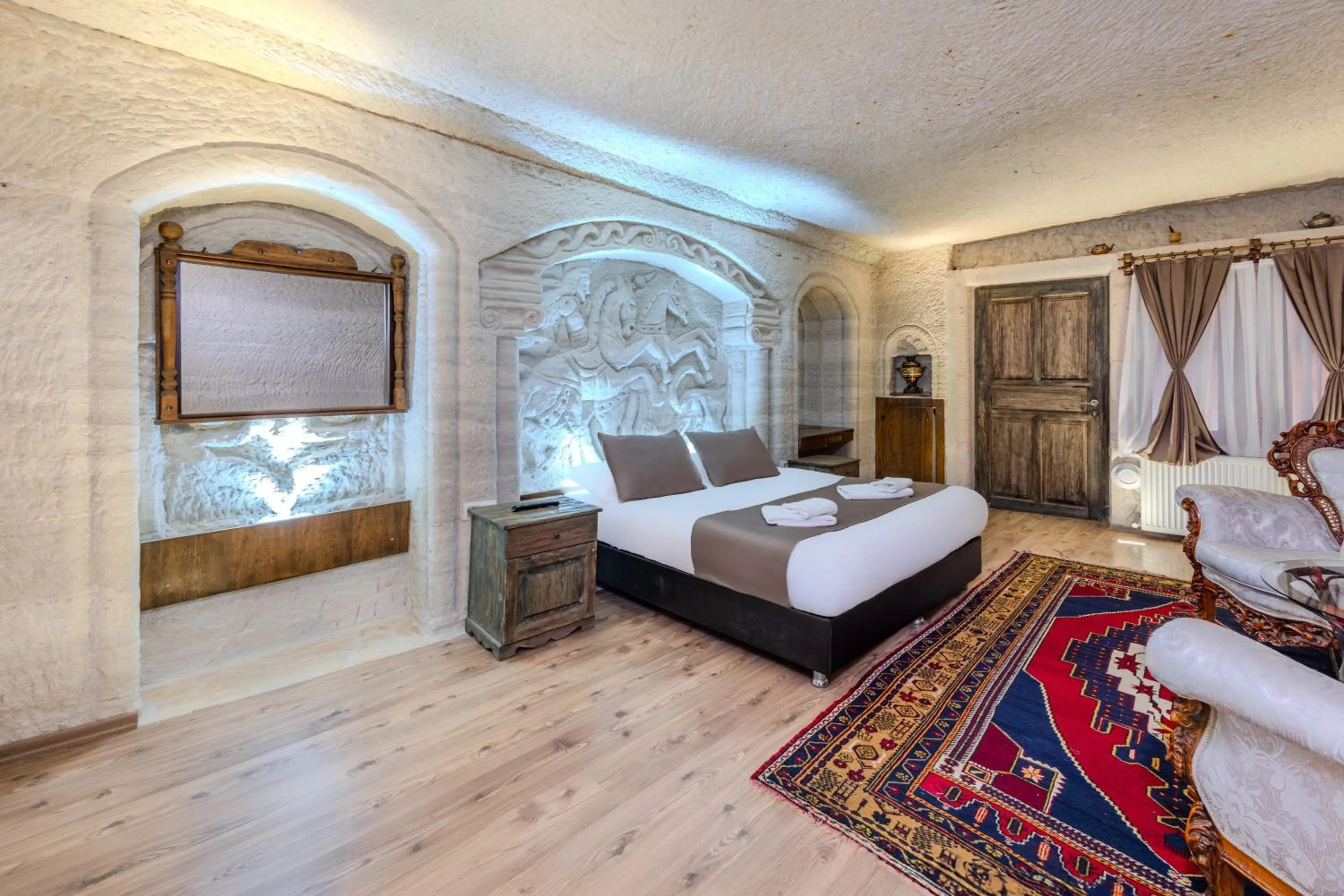 Bed in Kayatas Cave Suites