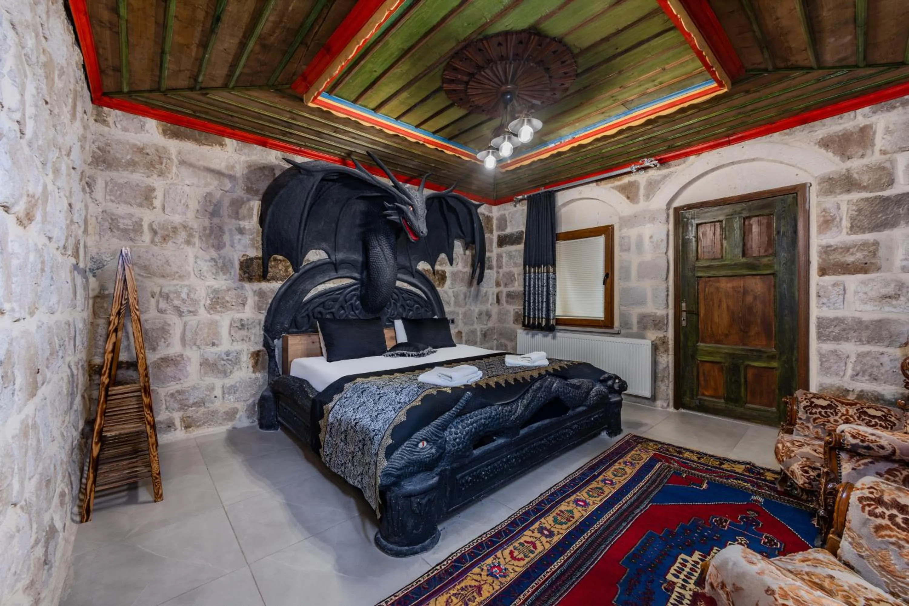 Bed in Kayatas Cave Suites