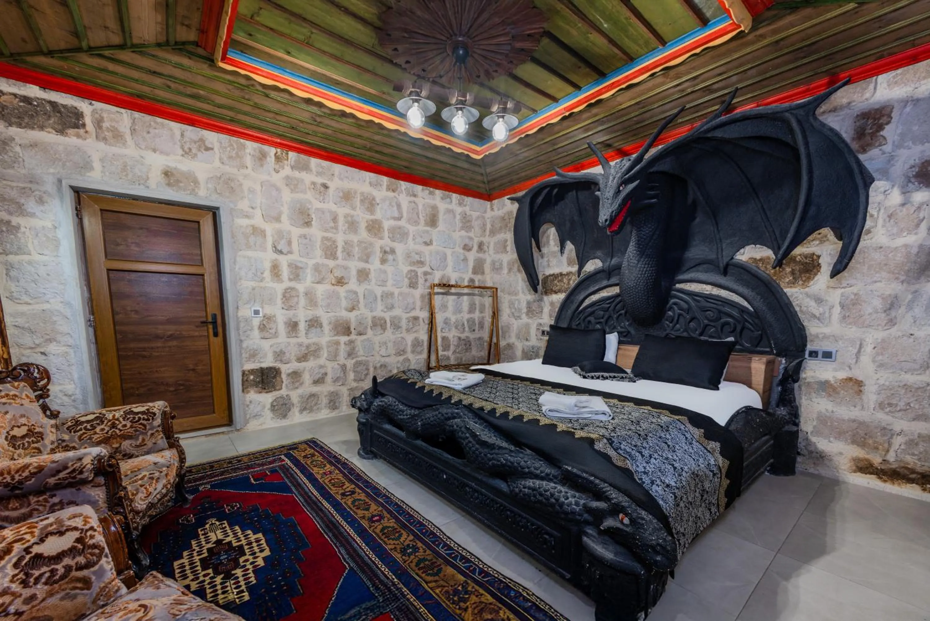 Bed in Kayatas Cave Suites