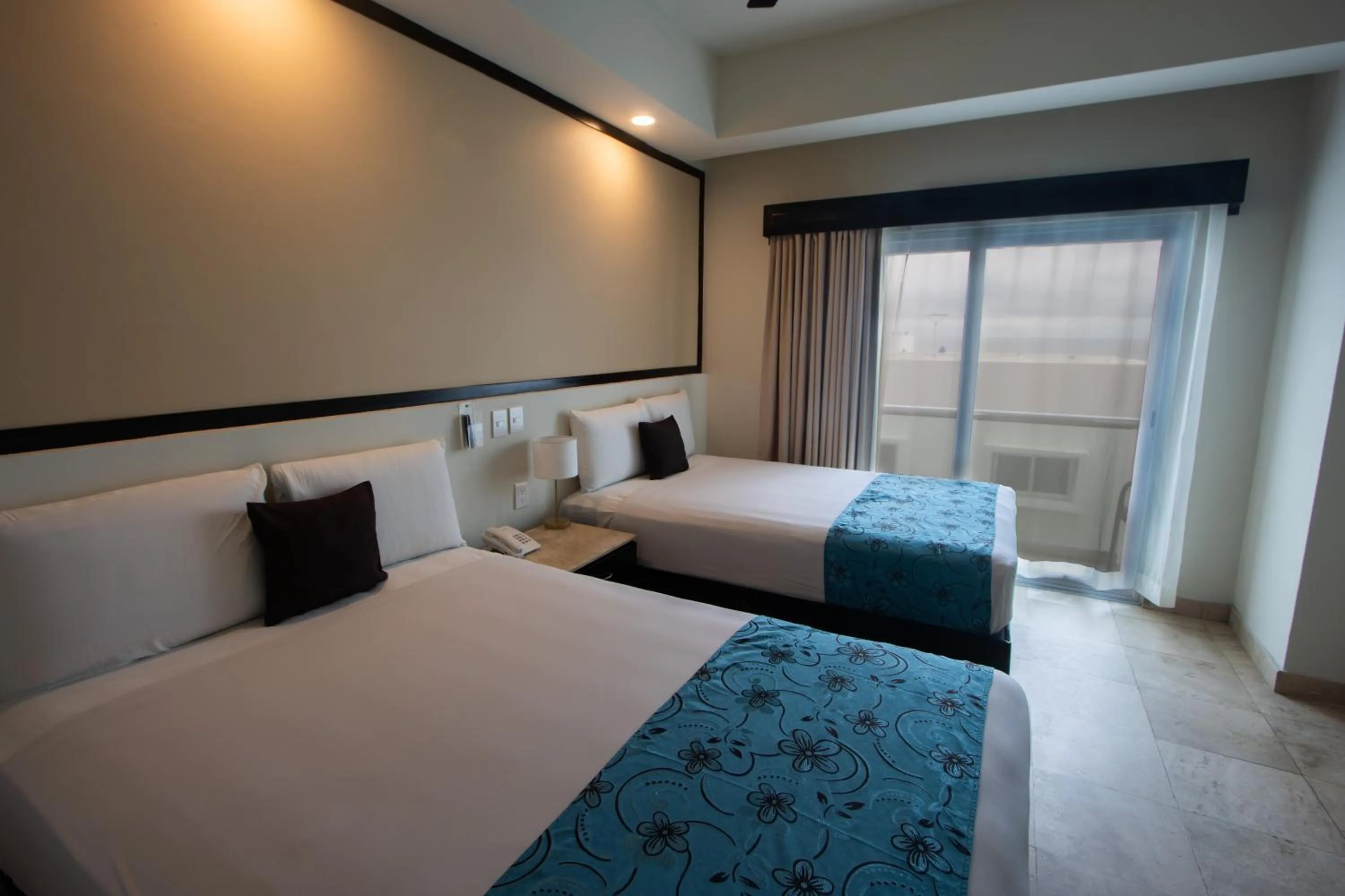 Bed in Coral Island Beach View Hotel