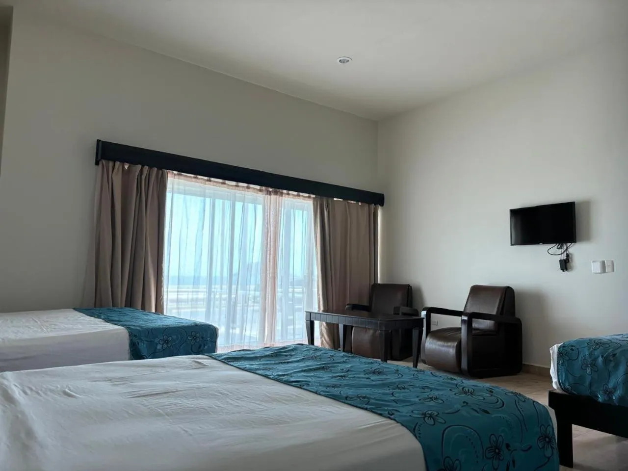 Bed in Coral Island Beach View Hotel