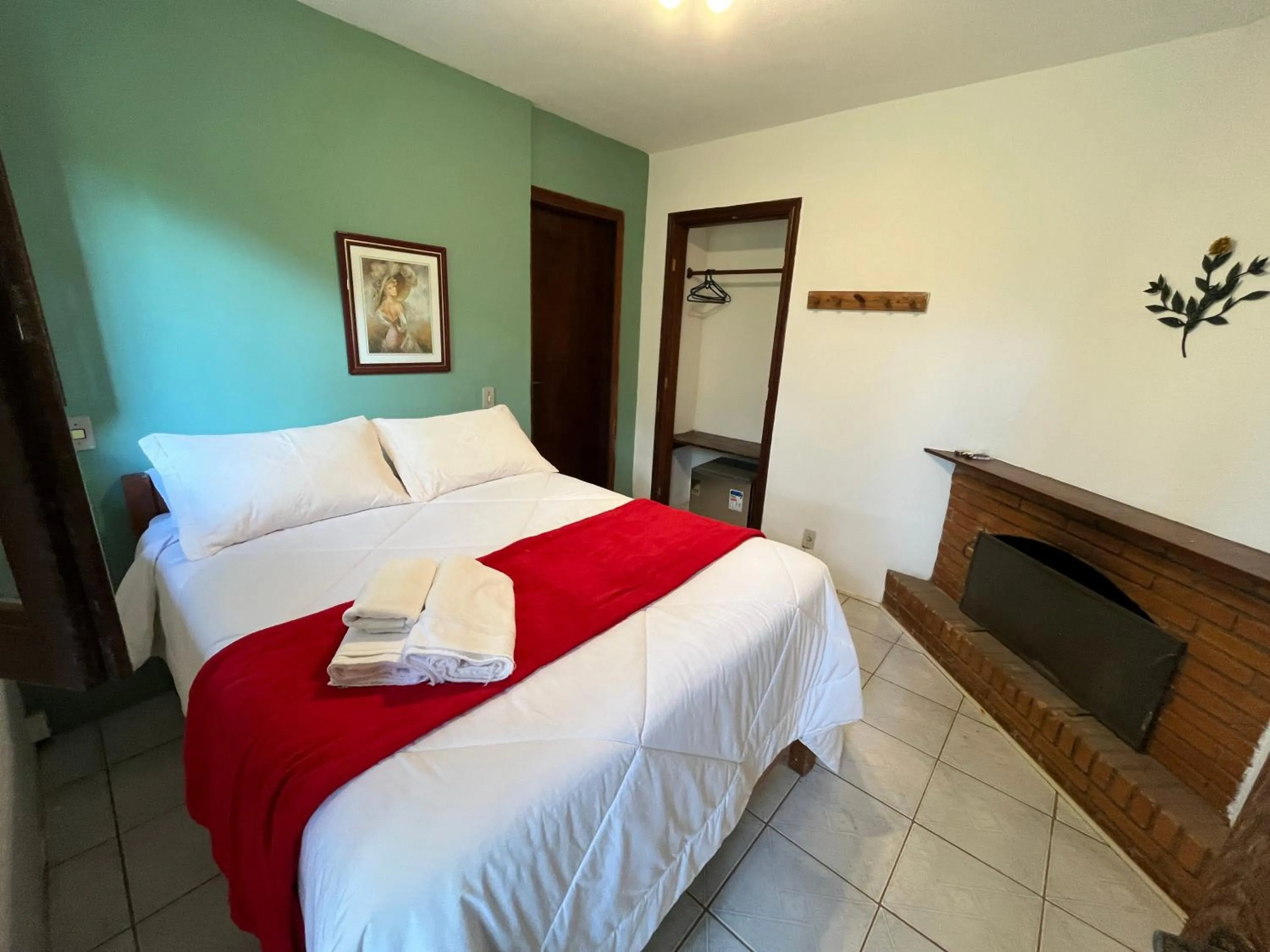 fireplace, Bed in Pousada Sonho Verde