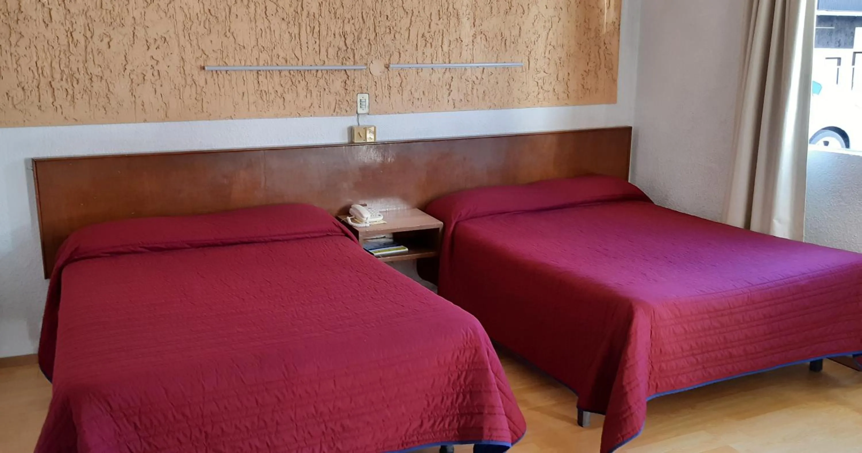 Bed in Hotel Zacatecas Courts