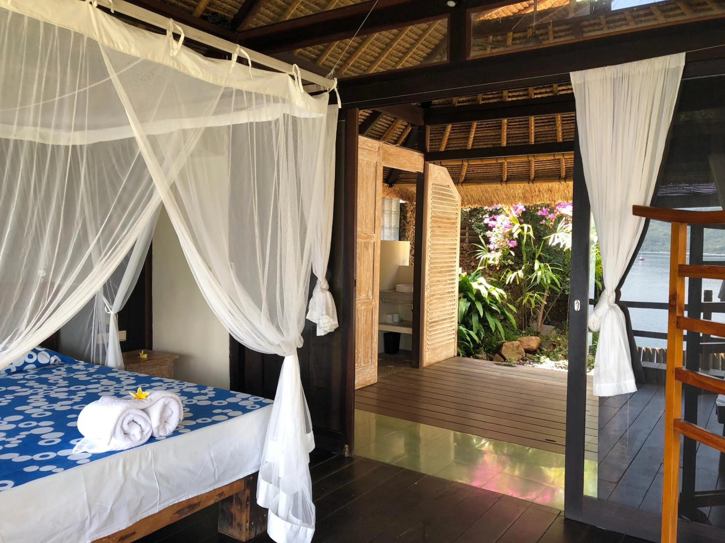 Photo of the whole room, Bed in Bloo Lagoon Eco Village