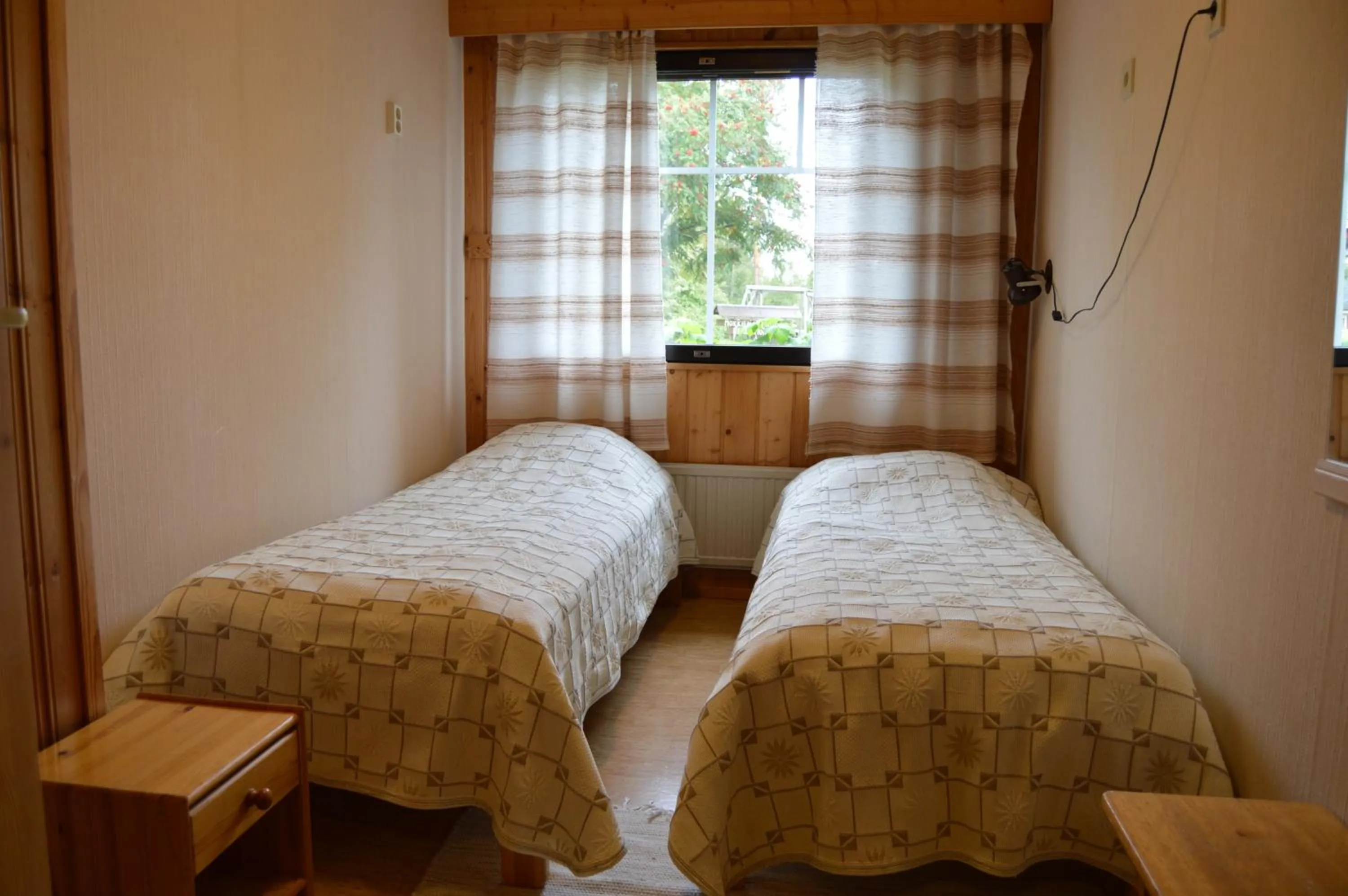 Bed in Rinnepelto Holiday Cottages
