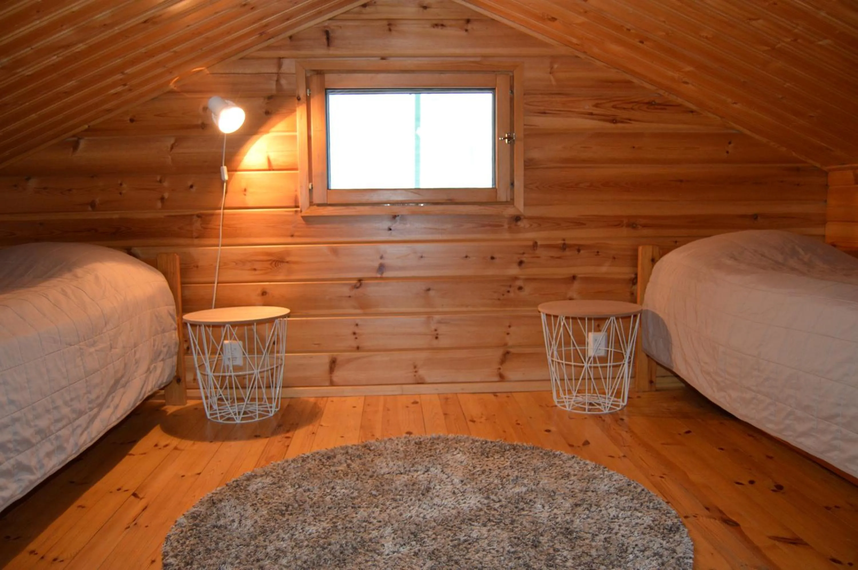 Bed in Rinnepelto Holiday Cottages