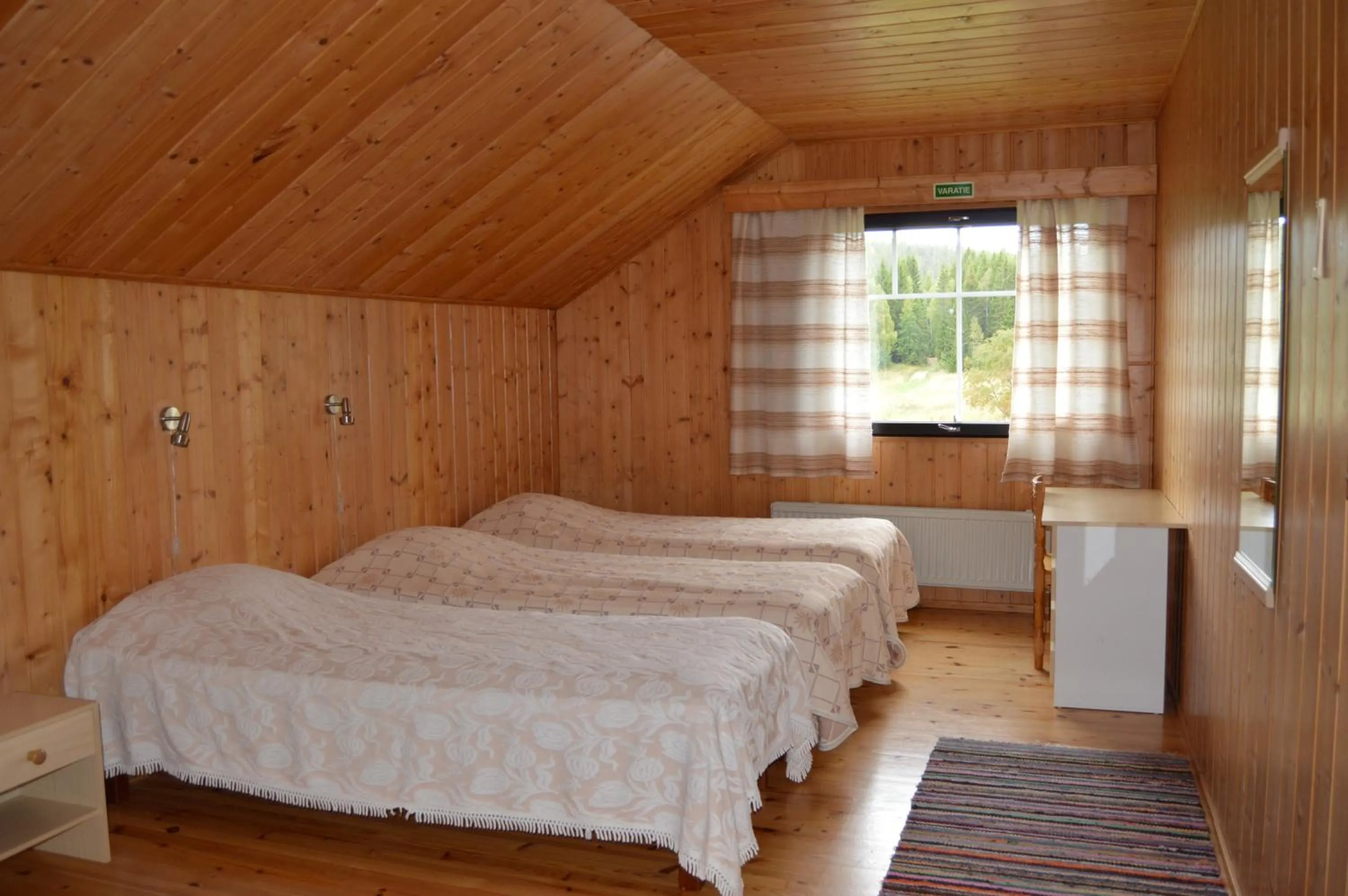 Bed in Rinnepelto Holiday Cottages