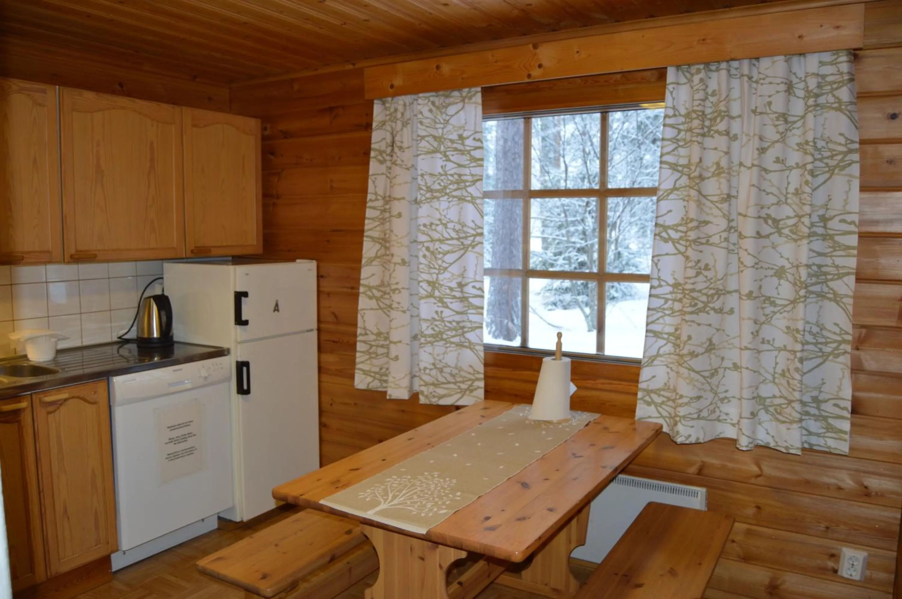 Kitchen or kitchenette in Rinnepelto Holiday Cottages