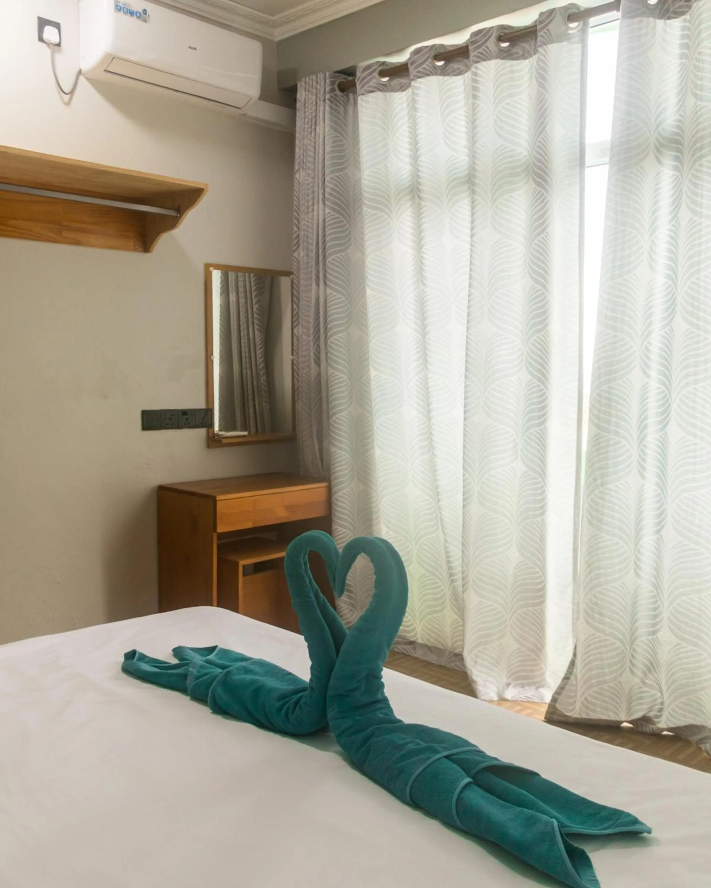 Bed in IRIS Beach Residence