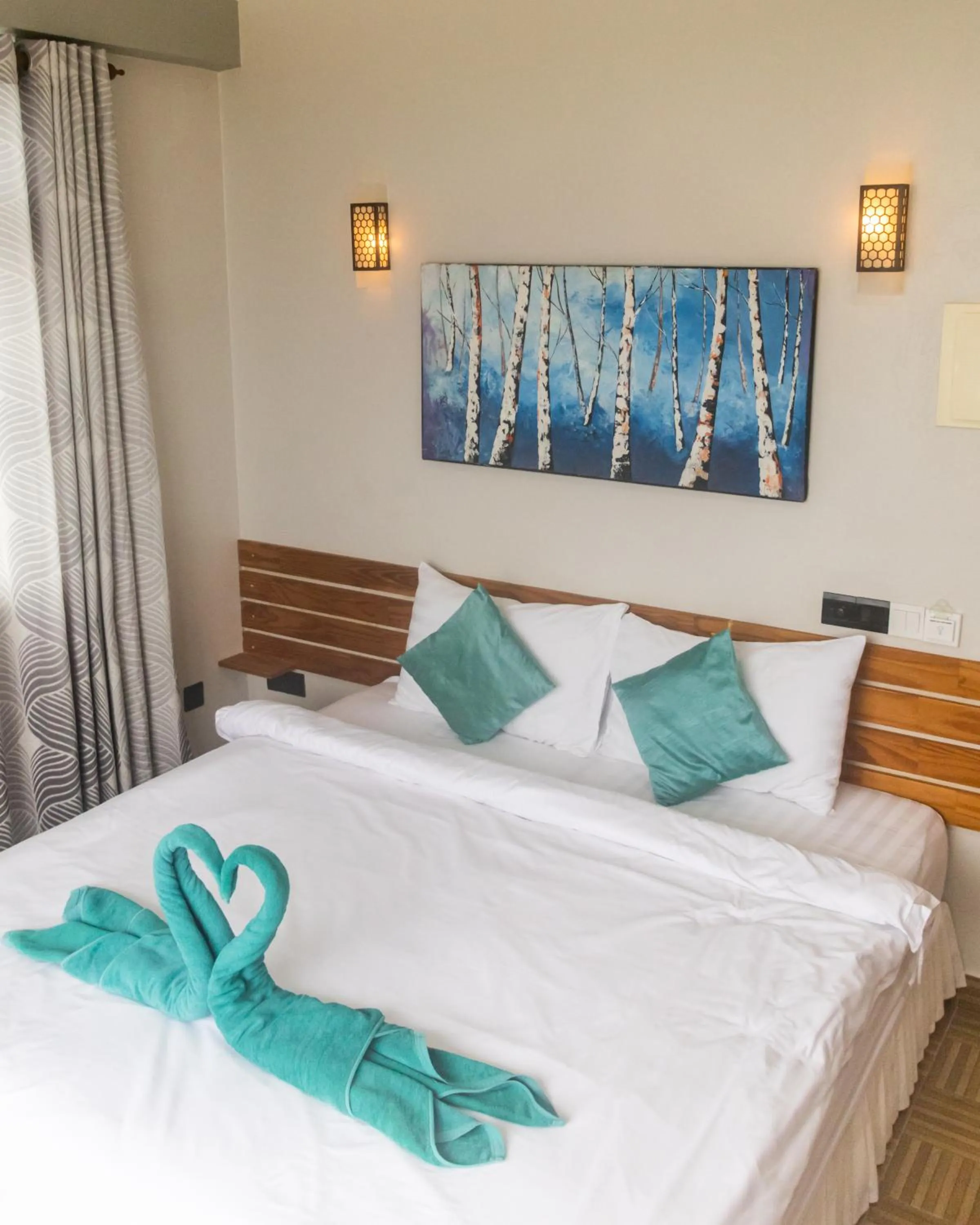 Bed in IRIS Beach Residence